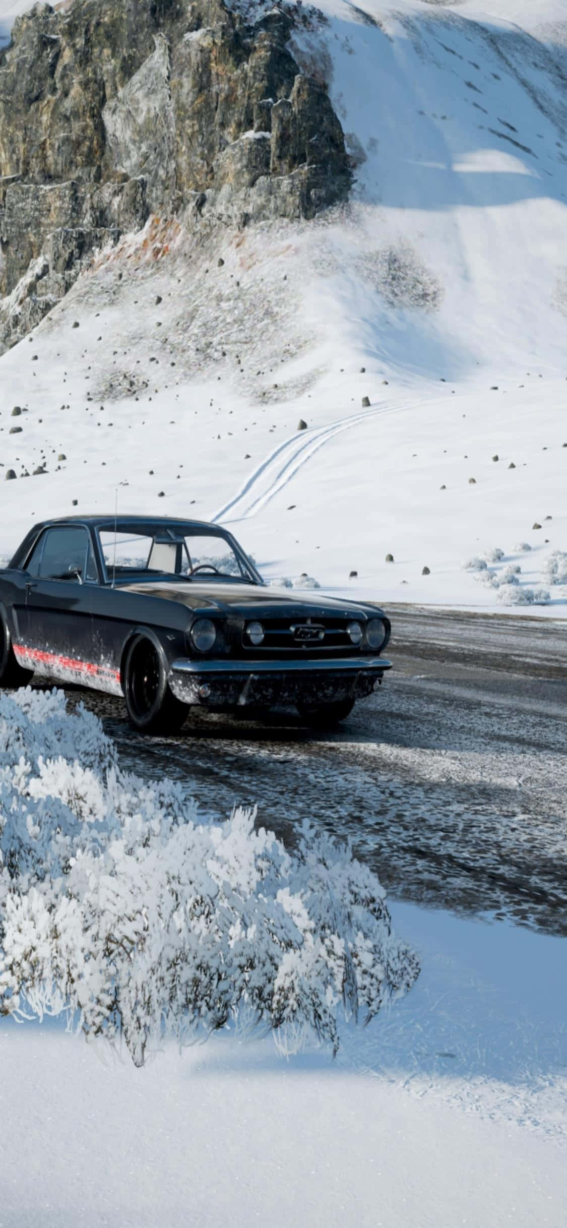 a black car driving down a snowy road Picha ya Ukuta