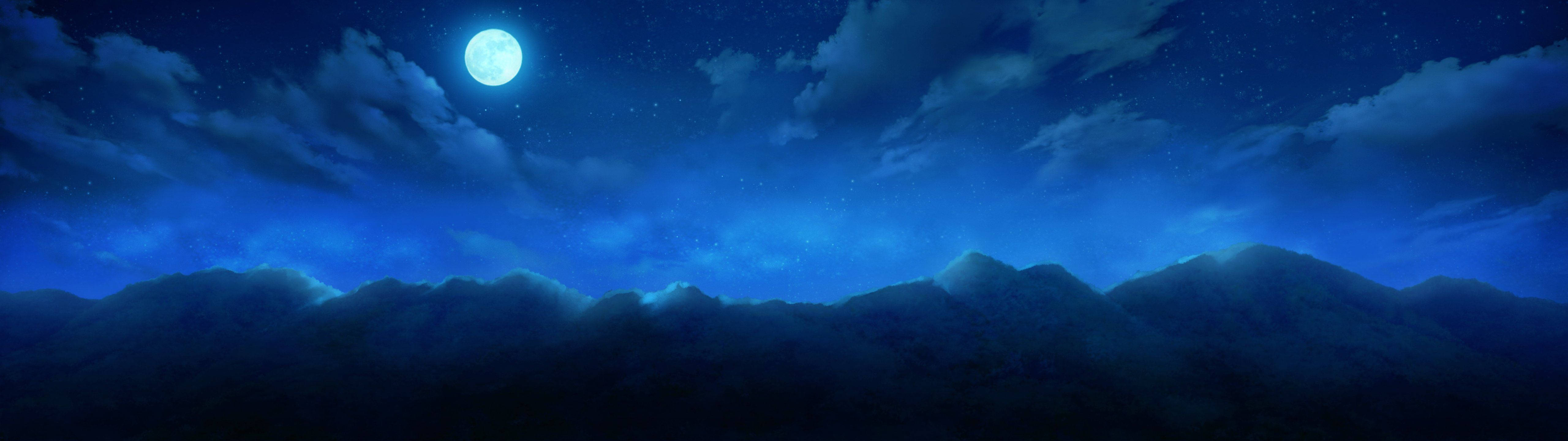 A bright full moon shining in a blue night sky Picha ya Ukuta