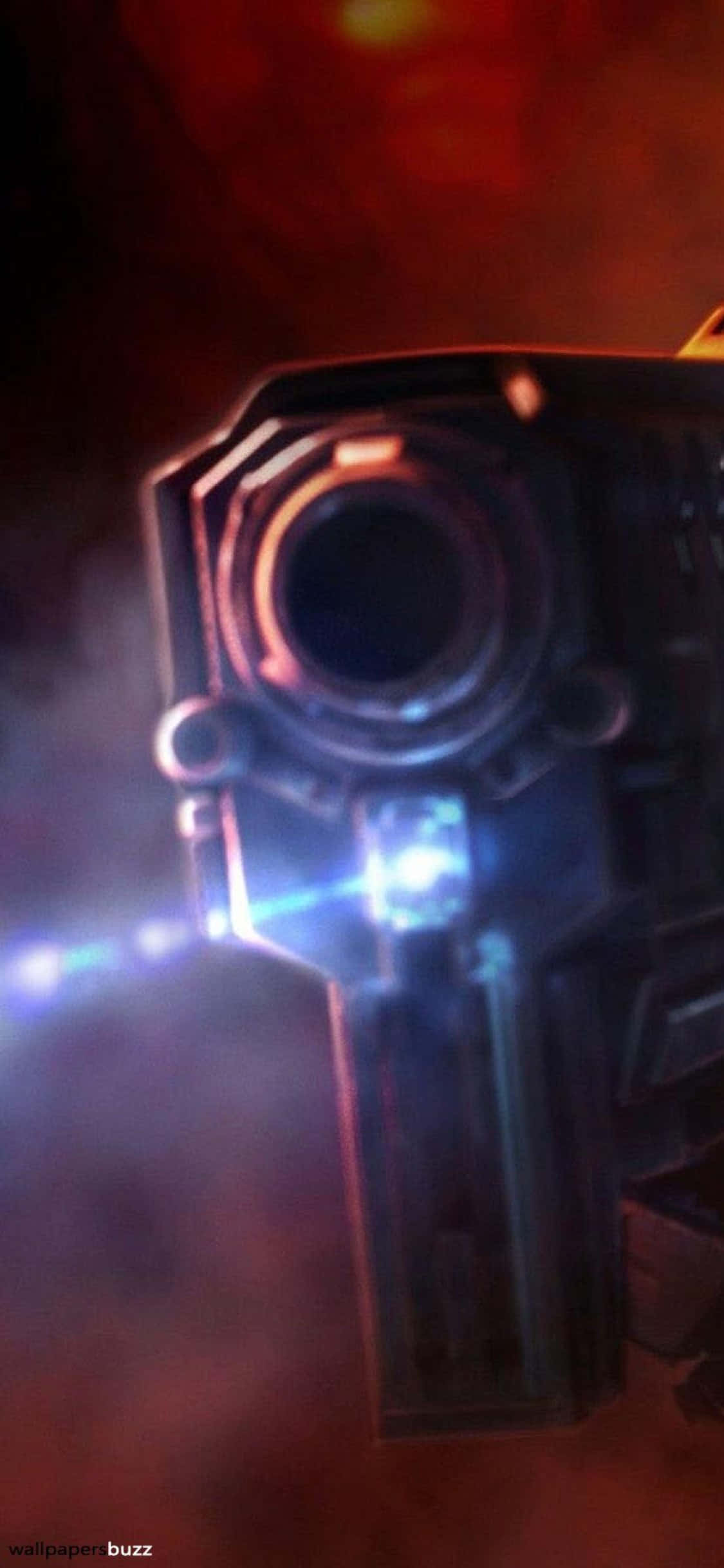 a gun with a red light in the background Picha ya Ukuta