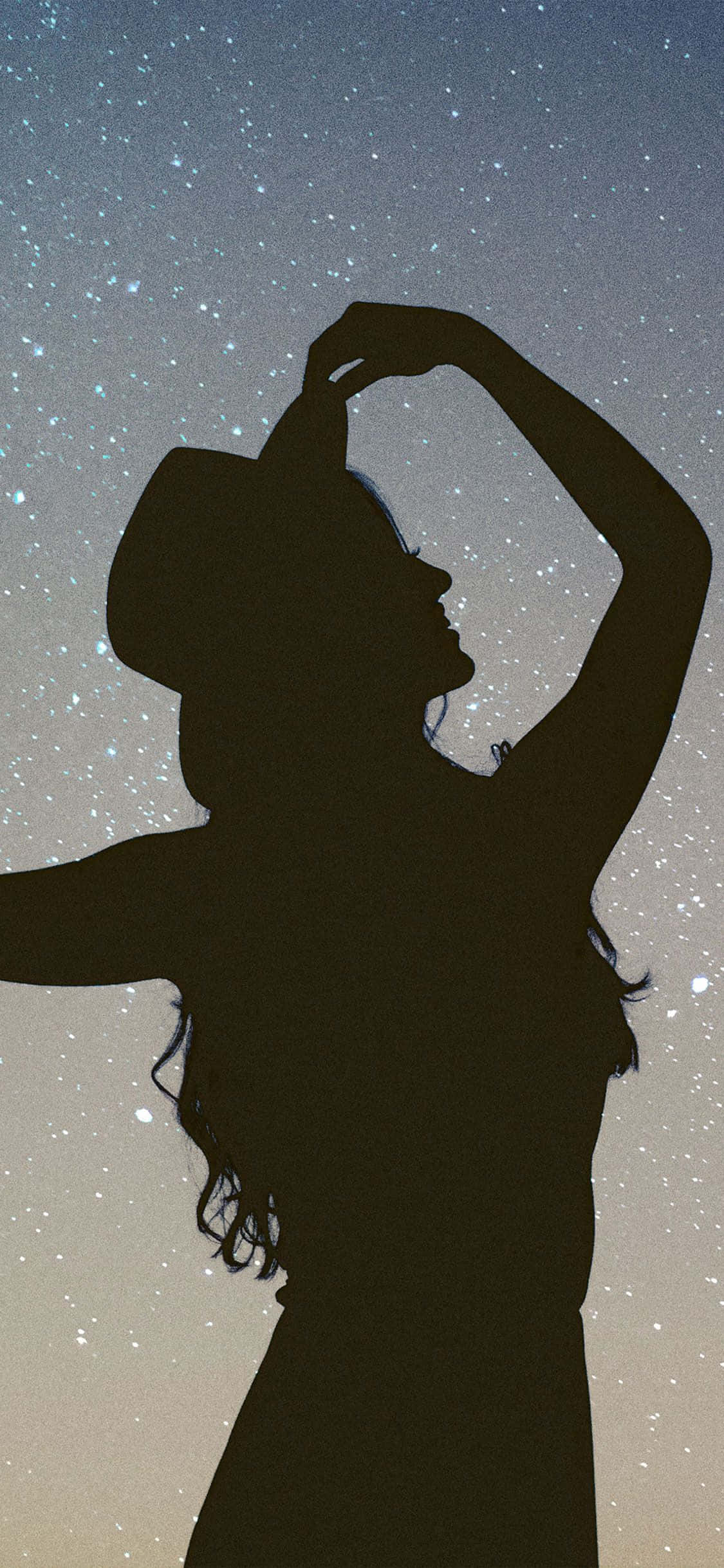 A lithe silhouette of a girl silhouetted against the setting sun Picha ya Ukuta