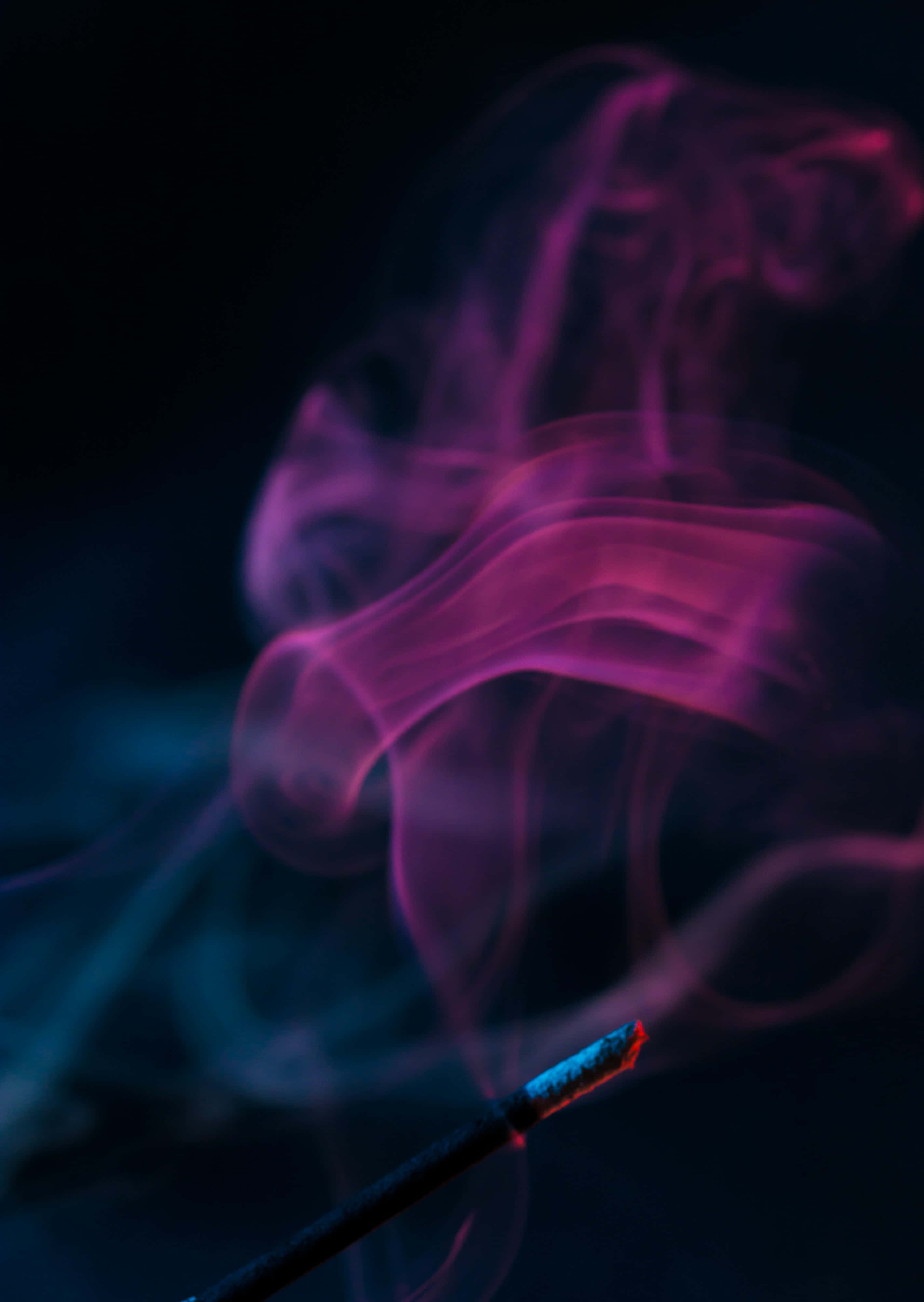 A majestic view of pink smoke in the atmosphere Picha ya Ukuta