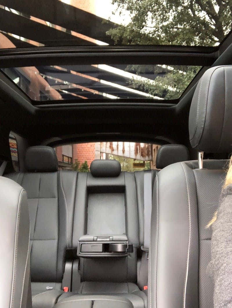 A modern family car on a scenic road trip Picha ya Ukuta