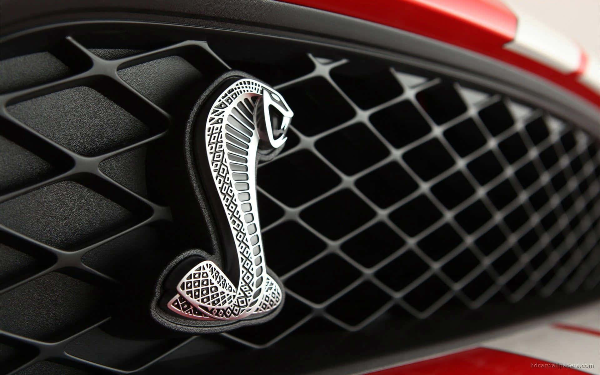 A stunning collection of luxury car logos displayed on a dark background. Picha ya Ukuta