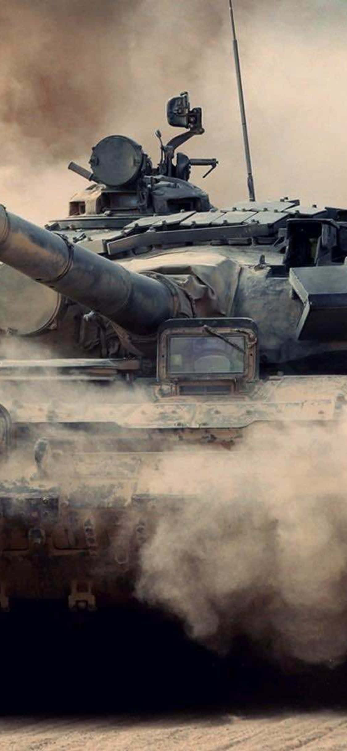 a tank is driving through the desert Picha ya Ukuta