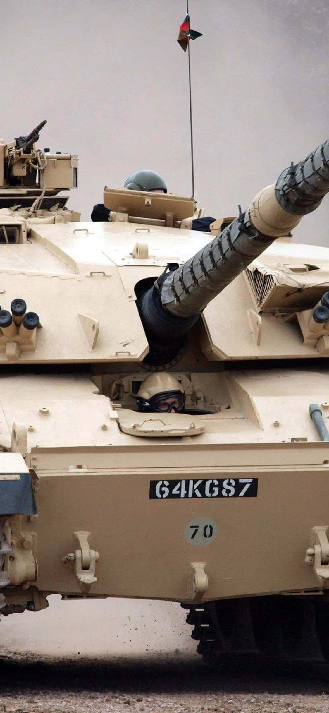 A View of an Army Tank Against a Glowing Sunset Picha ya Ukuta