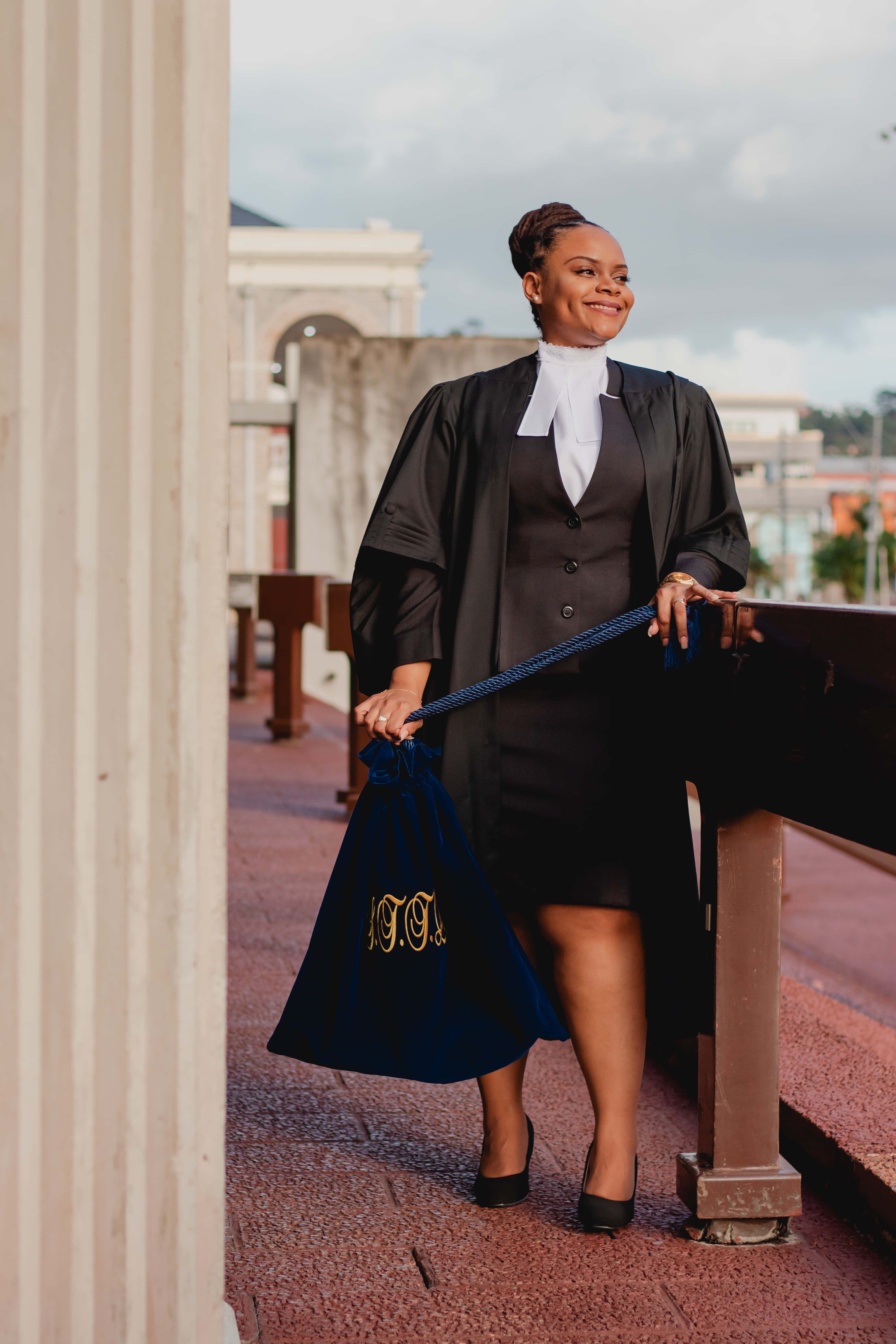a woman in a gown and robes standing on a bridge Picha ya Ukuta
