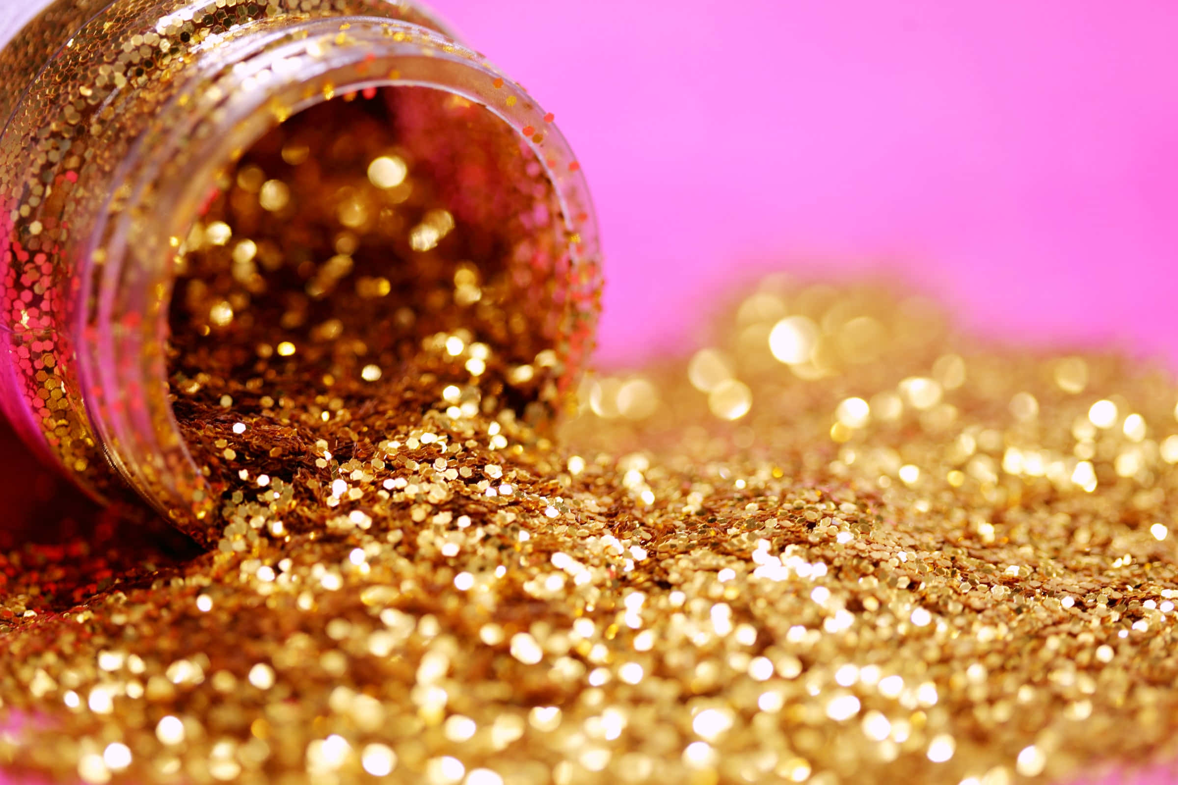 Asili ya Mng'ao wa Dhahabu wa Glitter Iliyomwagika Picha ya Ukuta