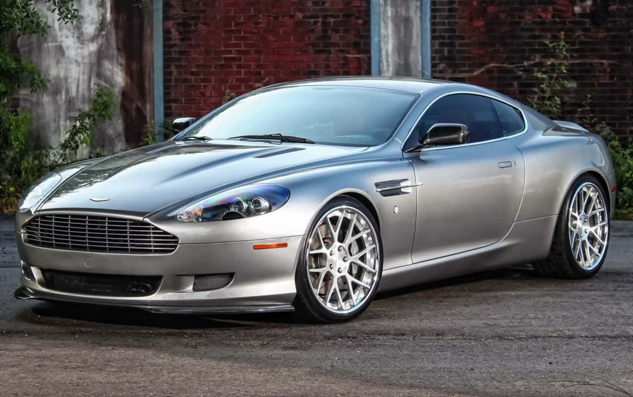 Aston Martin DB9 - Mchangamfu wa Nguvu na Ubunifu Picha ya Ukuta