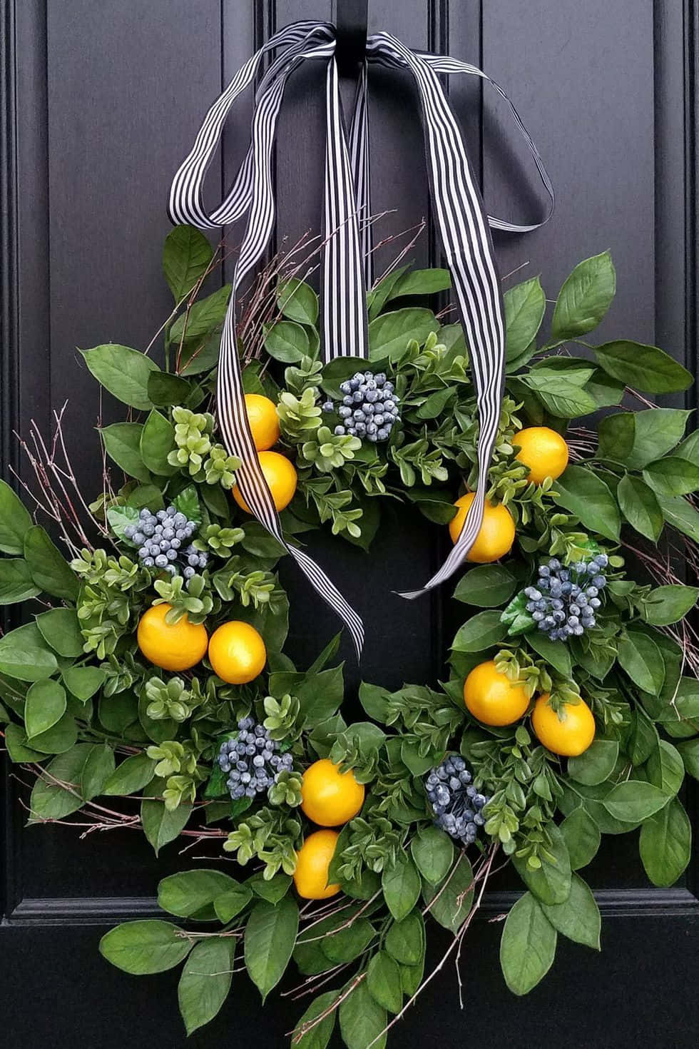 Beautiful Spring Wreaths with Colorful Flowers in a Garden Picha ya Ukuta