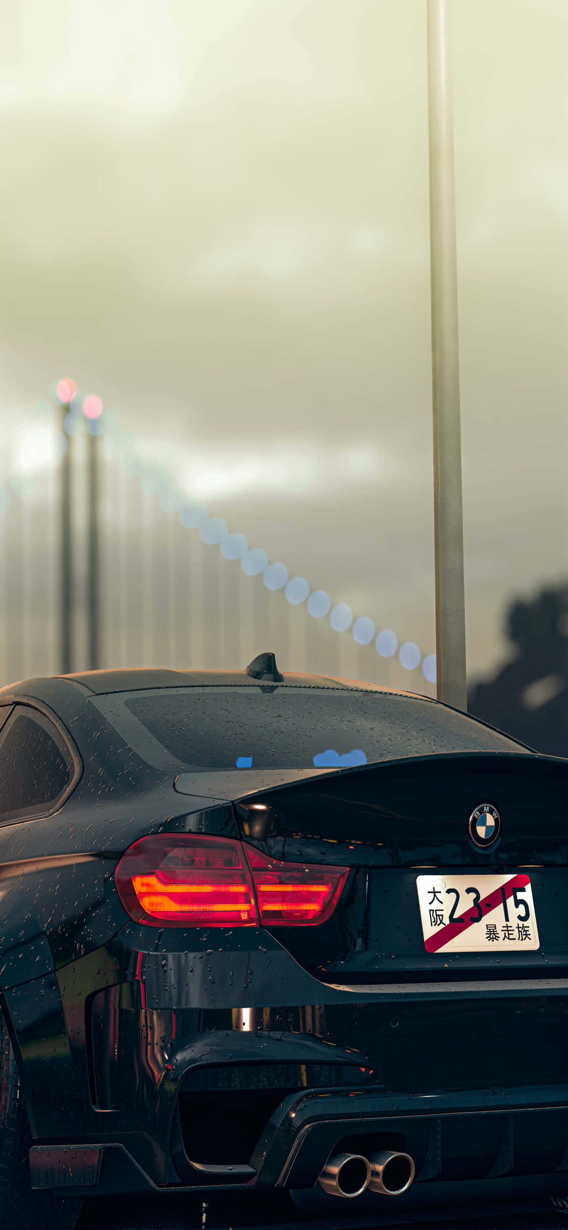 BMW Coupe yenye mwonekano mwafaka pamoja na Apple iPhone X ya kawaida. Picha ya Ukuta