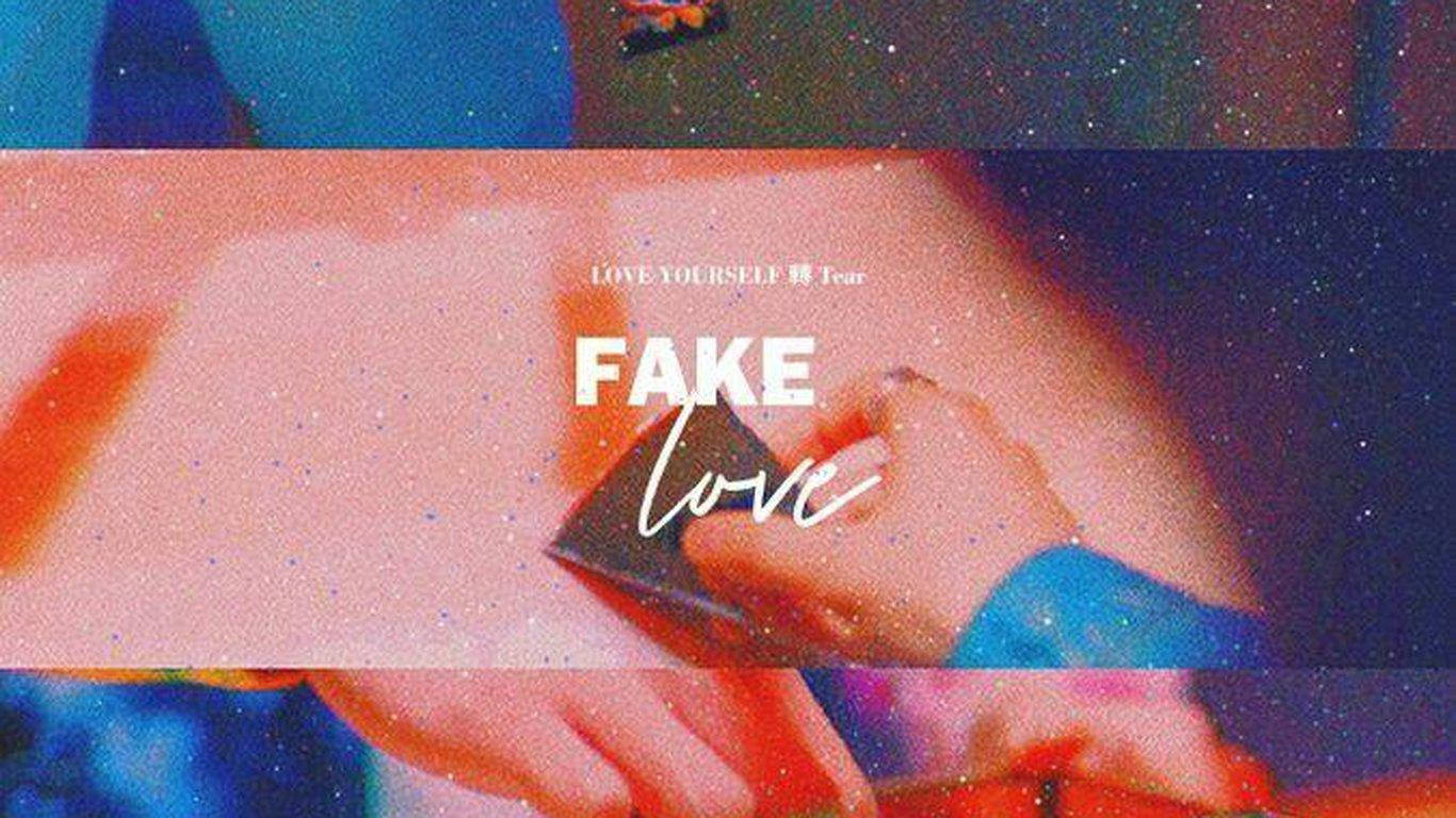 BTS Fake Love kwenye Picha ya Laptop yenye Chembechembe Picha ya Ukuta