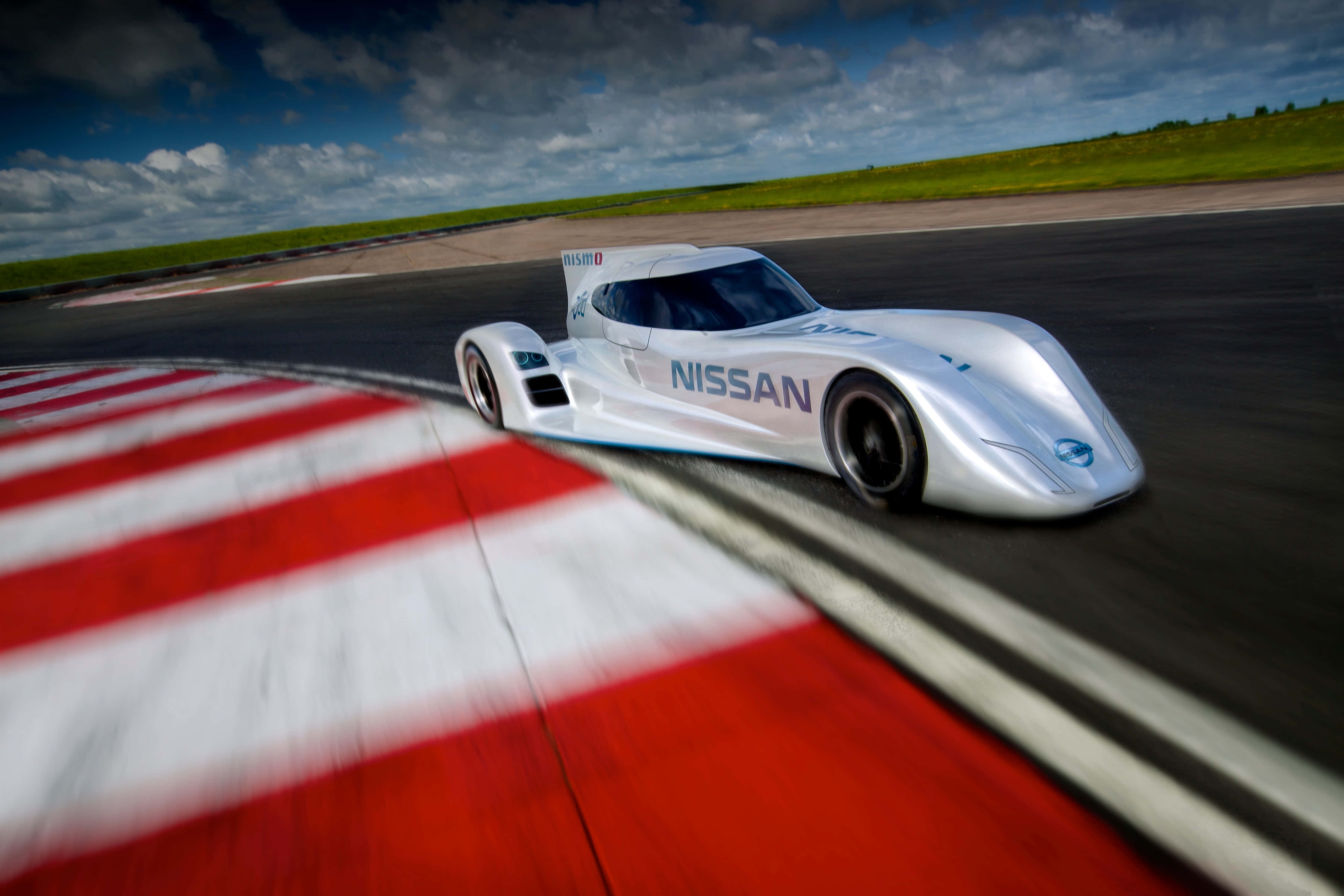 Captivating Car Racing On The Track Picha ya Ukuta