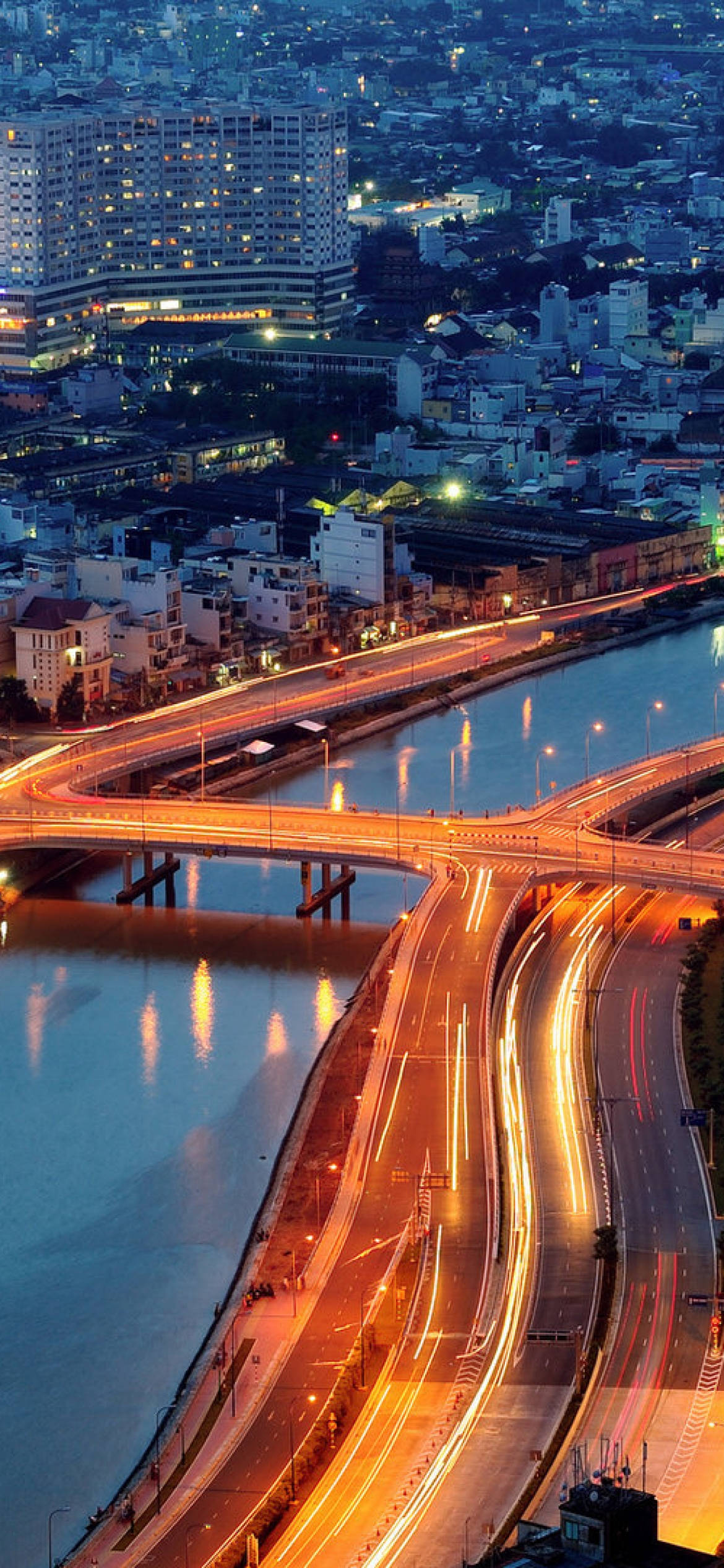 Captivating Ho Chi Minh City at night with bustling traffic Picha ya Ukuta