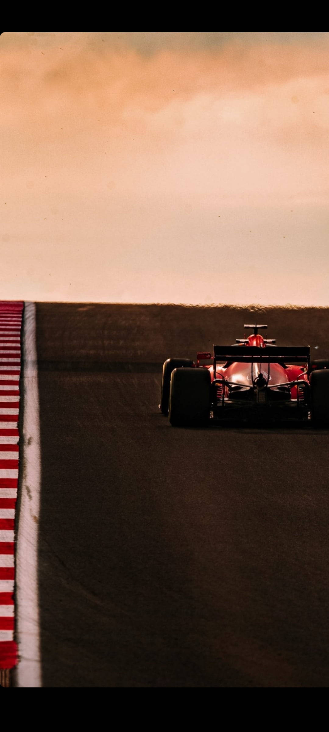 Charles Leclerc Akiendesha Gari Kuzama Jua Linapozama Picha ya Ukuta