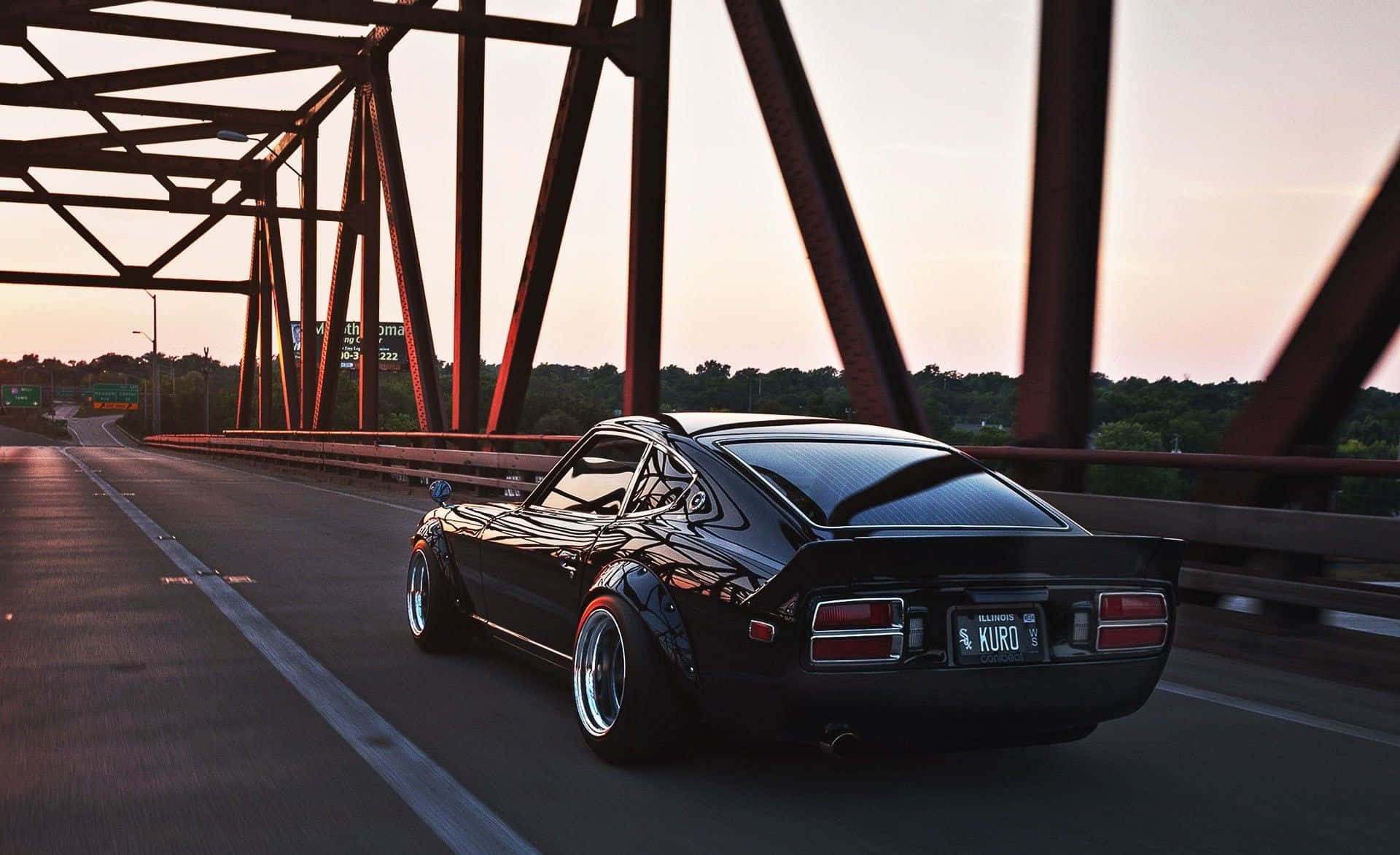 Classic Datsun on display in a beautiful sunset Picha ya Ukuta