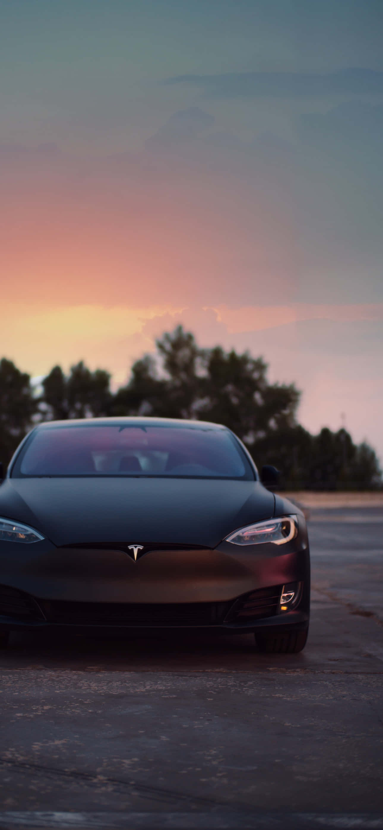 Enjoy a wireless world with the Tesla iPhone. Picha ya Ukuta