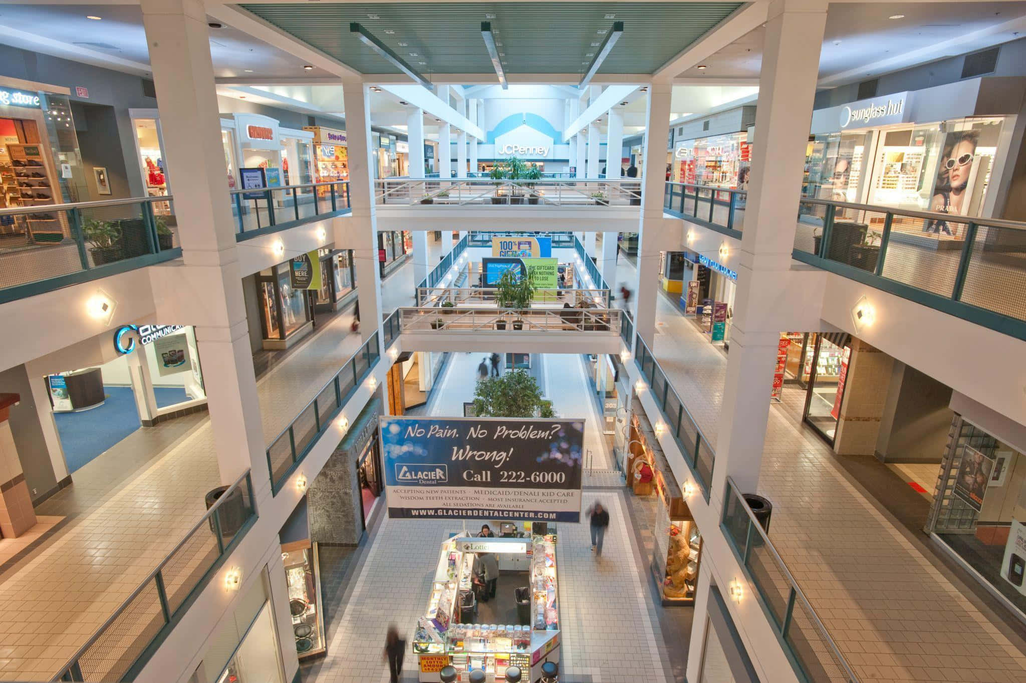 Enjoy the vibrant atmosphere of the modern shopping mall. Picha ya Ukuta