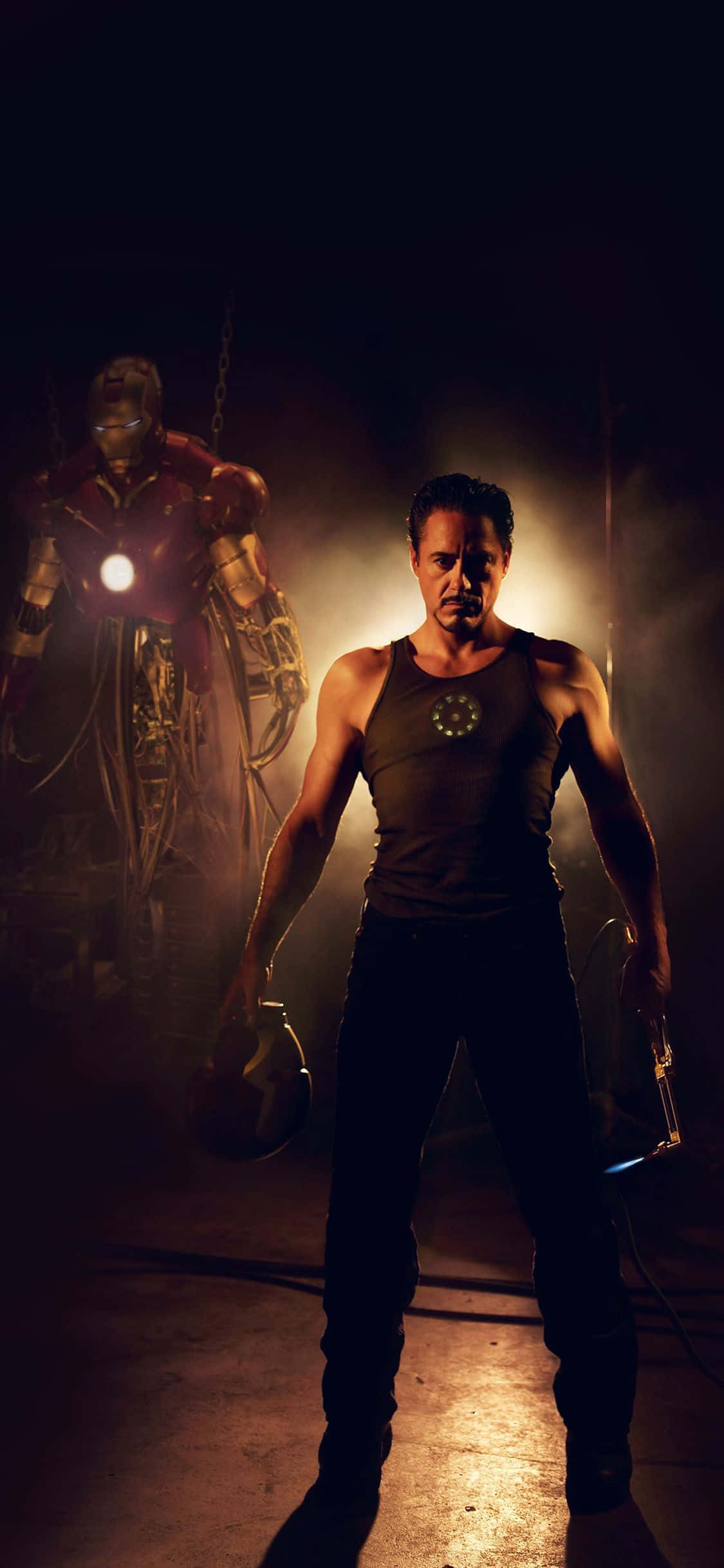 Enter the technological age with Iron Man's Apple iPhone X Picha ya Ukuta