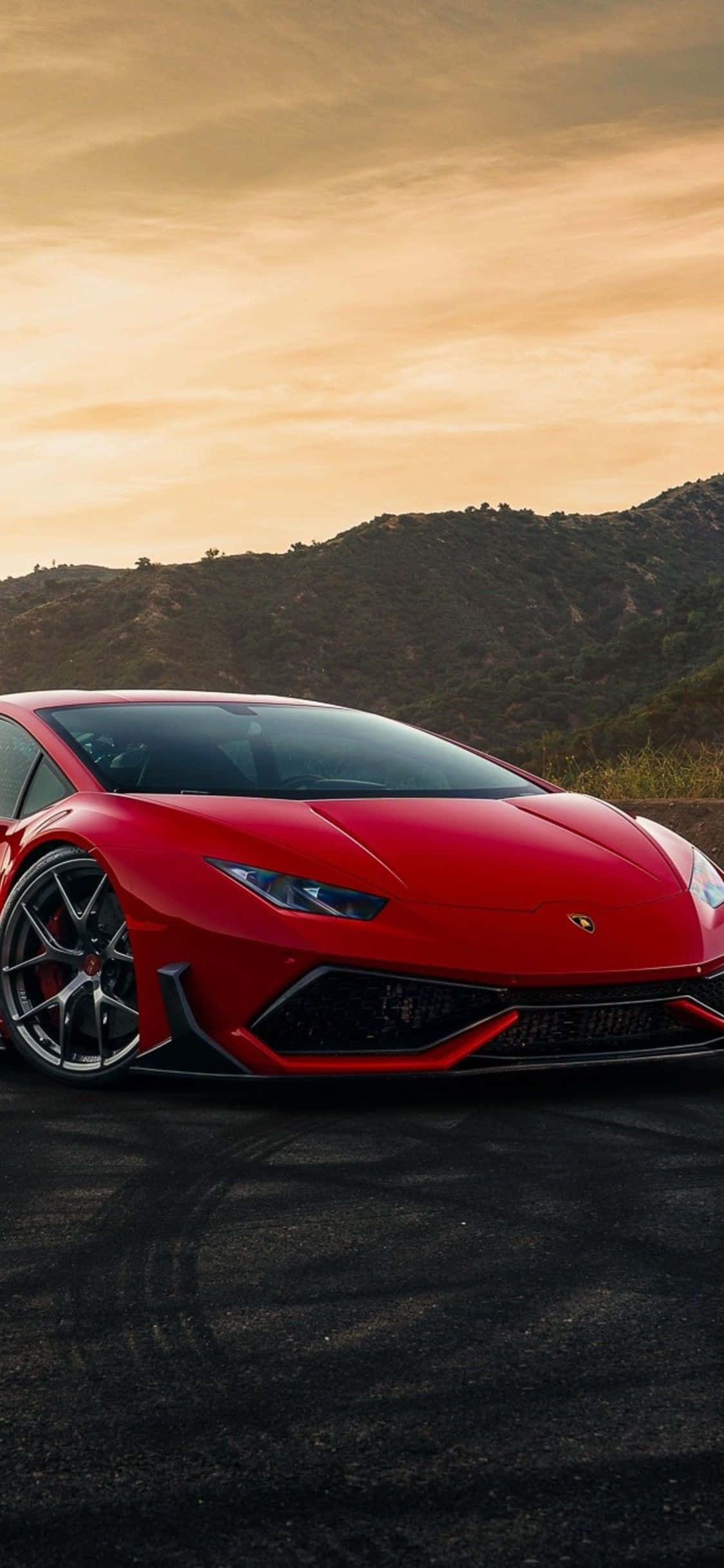 Feel the power of an elegant red car on your iPhone. Picha ya Ukuta