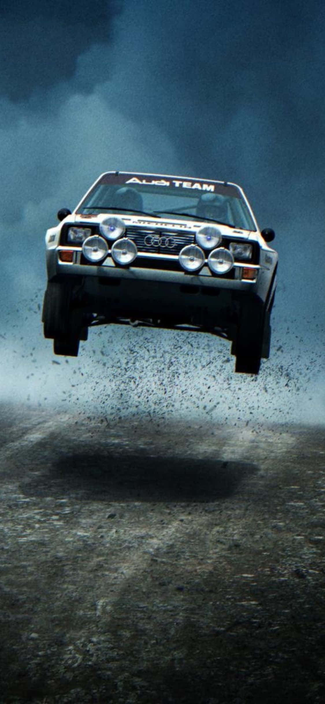 Feel the Rush of Excitement with iPhone Xs Dirt Rally Picha ya Ukuta