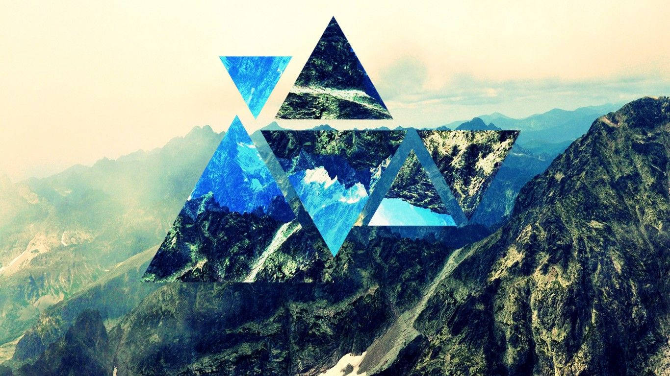 Geometric polyscape featuring three sharp-edged stone triangles off a snow-capped mountain. Picha ya Ukuta