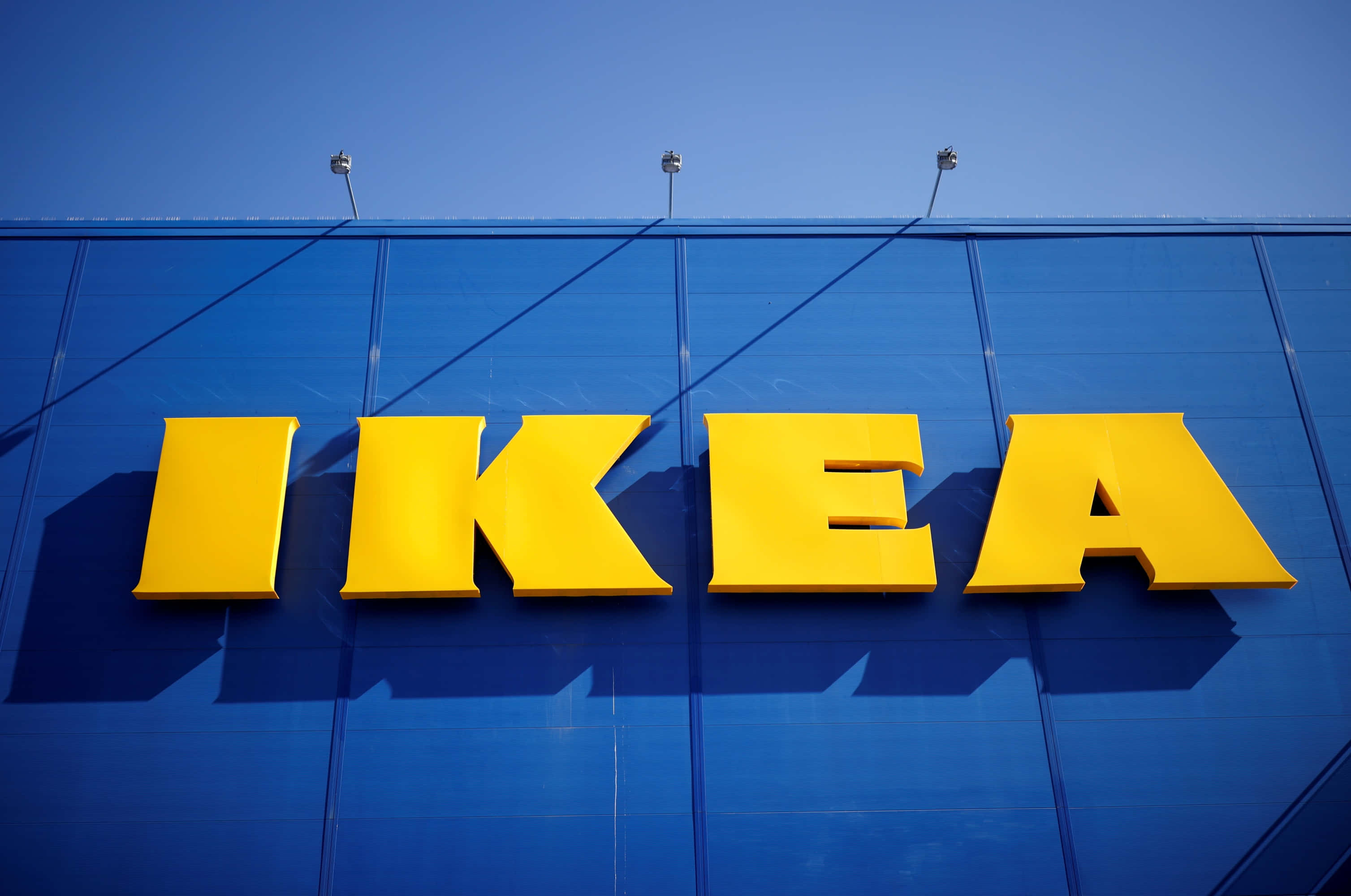 ikea's new logo is on a blue building Picha ya Ukuta