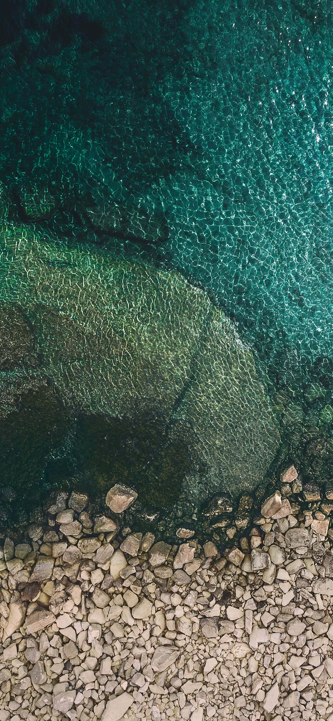 iOS 1 Rocky Seaside Picha ya Ukuta