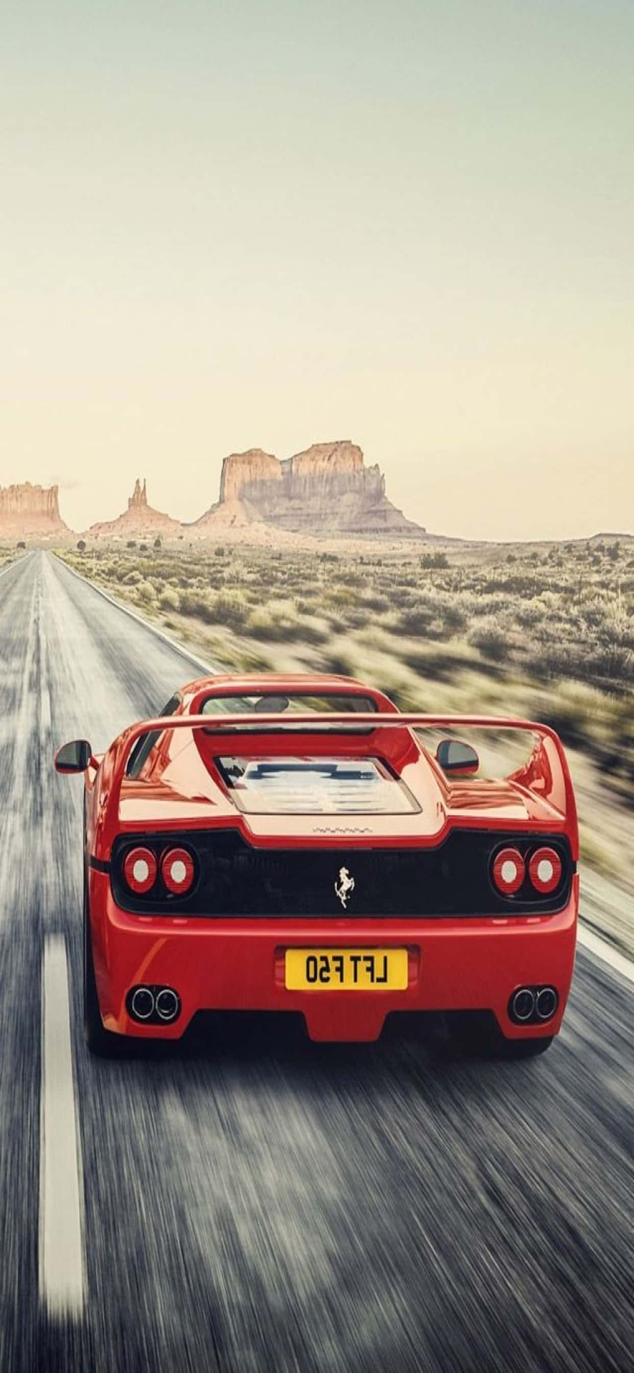iPhone Xs Max Ferrari Background Red Ferrari F50 On The Road Picha ya Ukuta