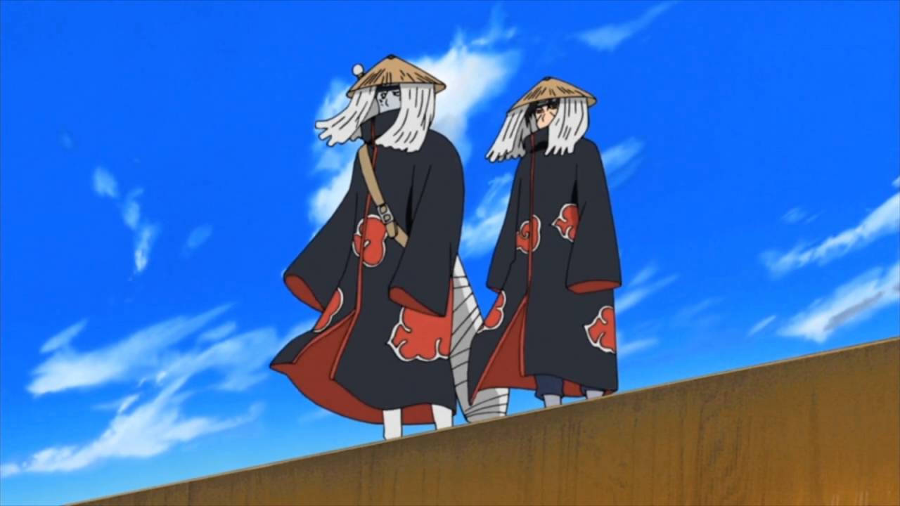 Itachi na Kisame wakifukuzana juu ya maporomoko ya maji Picha ya Ukuta