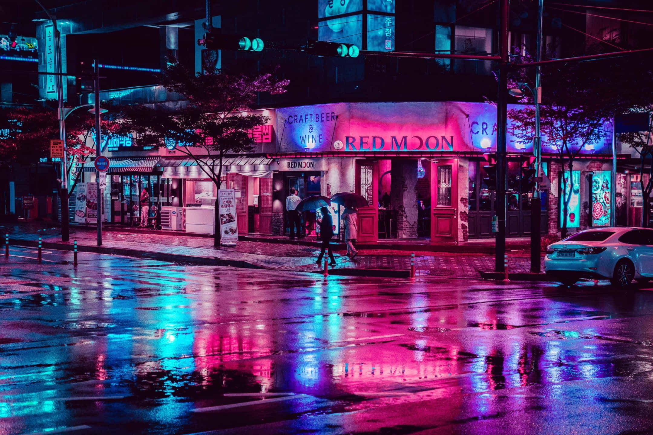 Jitumbukize katika mandhari ya kuvutia ya Neon City. Picha ya Ukuta