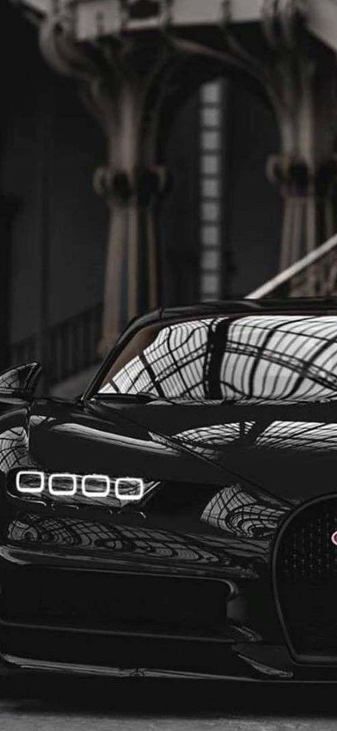 Kasi ya mwendo na iPhone Xs mpya kabisa na Bugatti Chiron Picha ya Ukuta