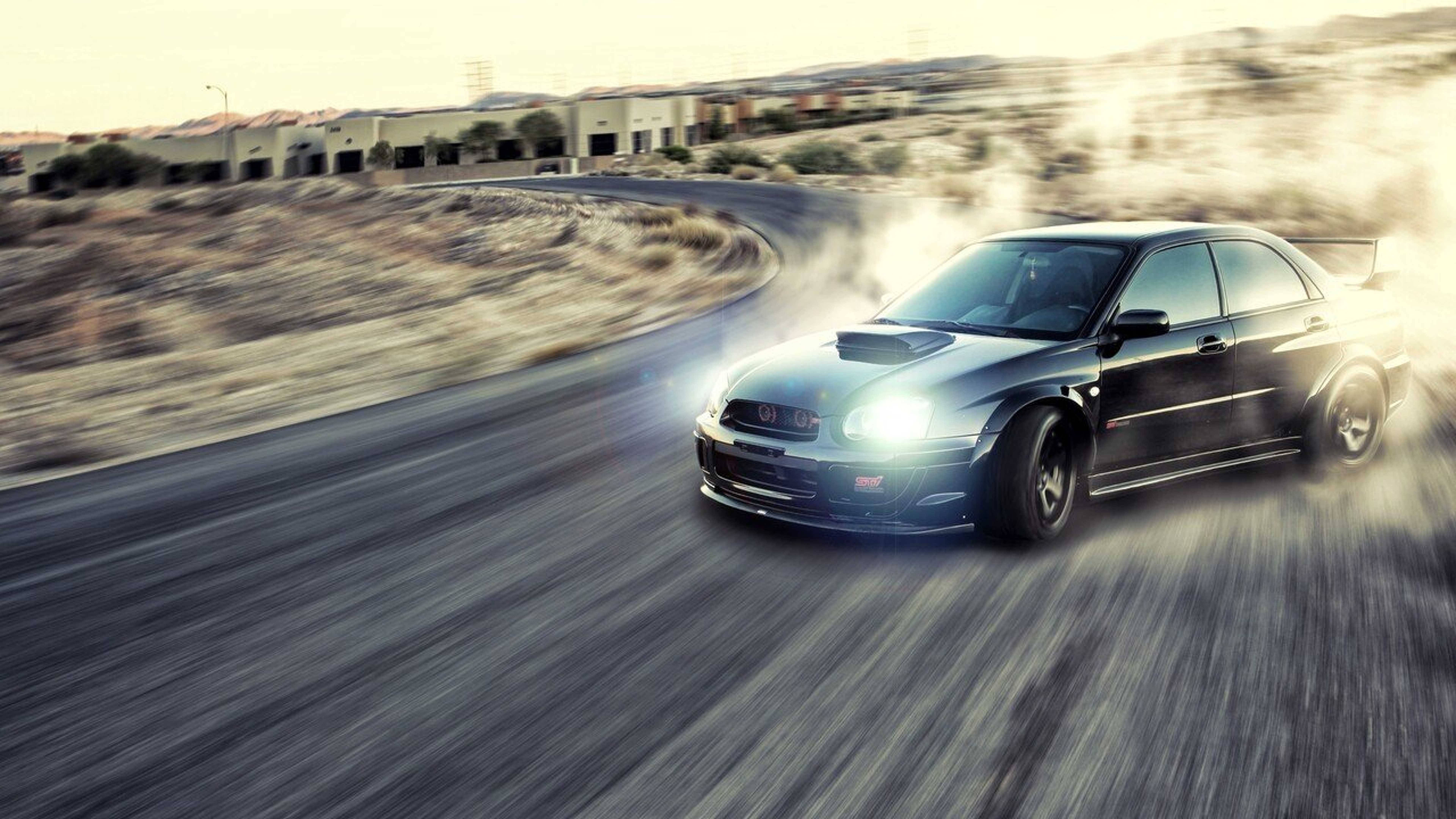Kichwa: Subaru Impreza WRX ya Drift Inayonguruma Ikiwa Kazini Picha ya Ukuta