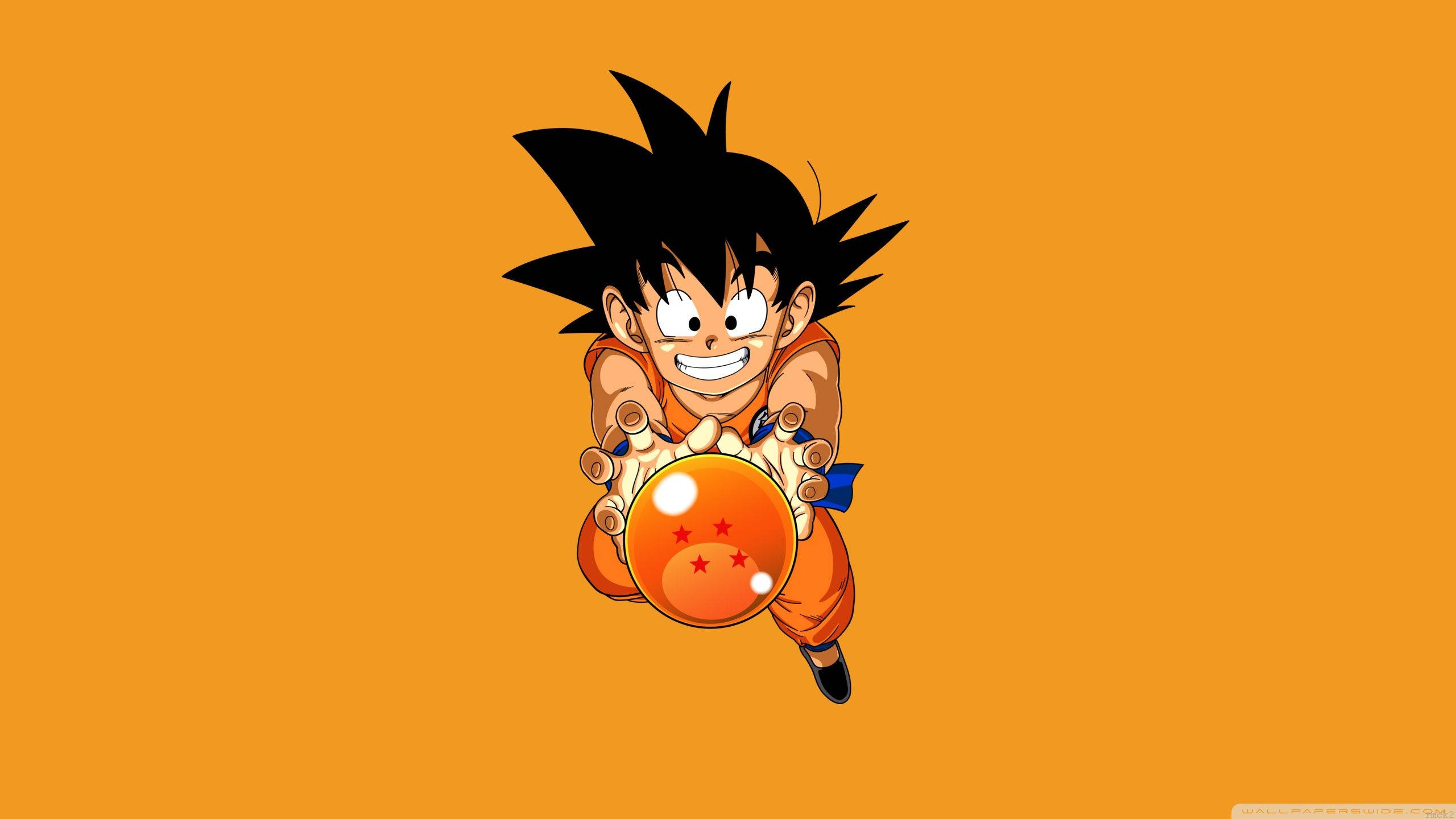 Kid Goku Akishikilia Kwa Fahari Mpira wa Joka wenye Nyota Nne Picha ya Ukuta
