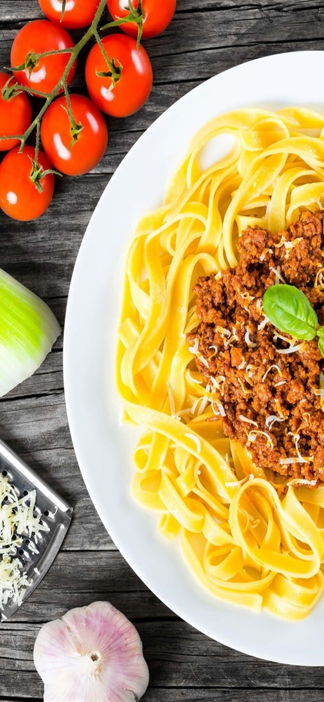 Kipande cha Kuvutia - iPhone X inaweka rangi za kuvutia na mwonekano wa pasta. Picha ya Ukuta