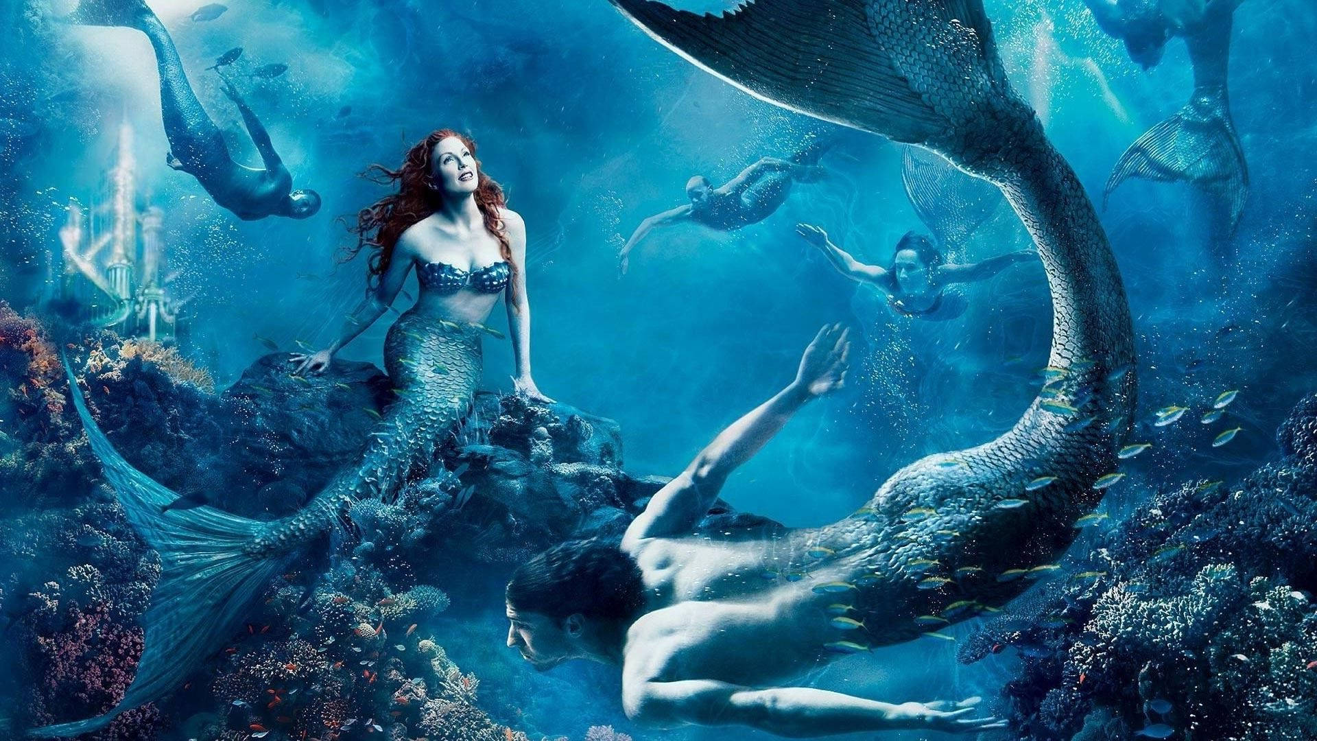Kundi la mermaid wenye furaha wakiogelea chini ya maji Picha ya Ukuta