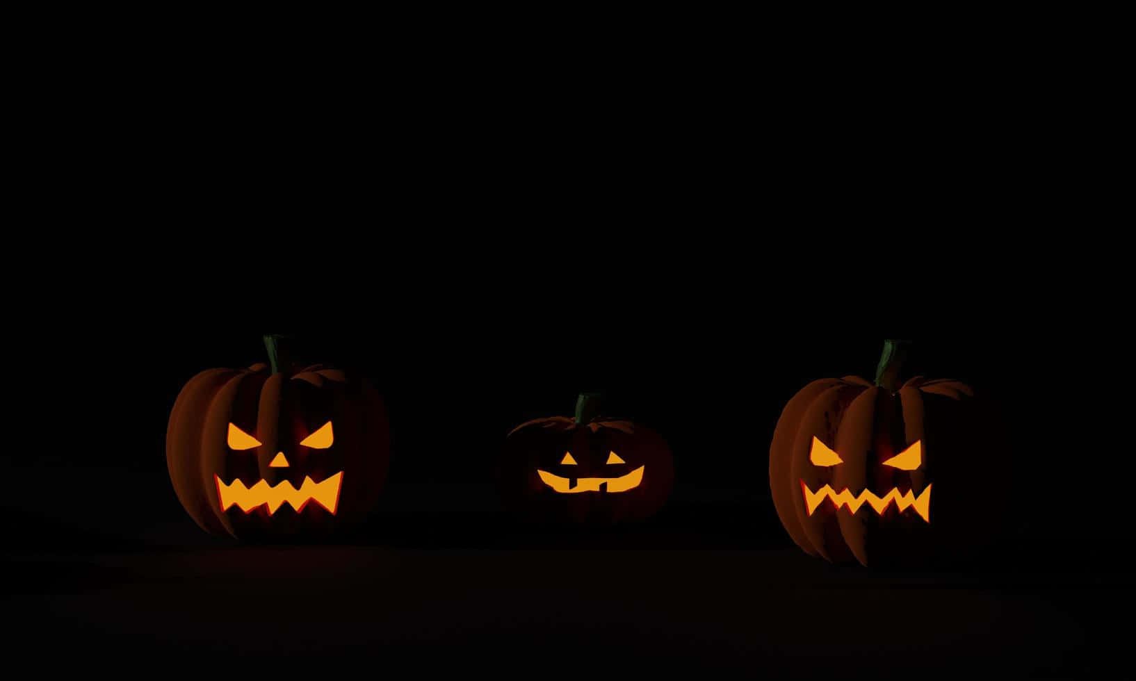 Mabuyu Matatu ya Halloween Nyuma Giza Picha ya Ukuta