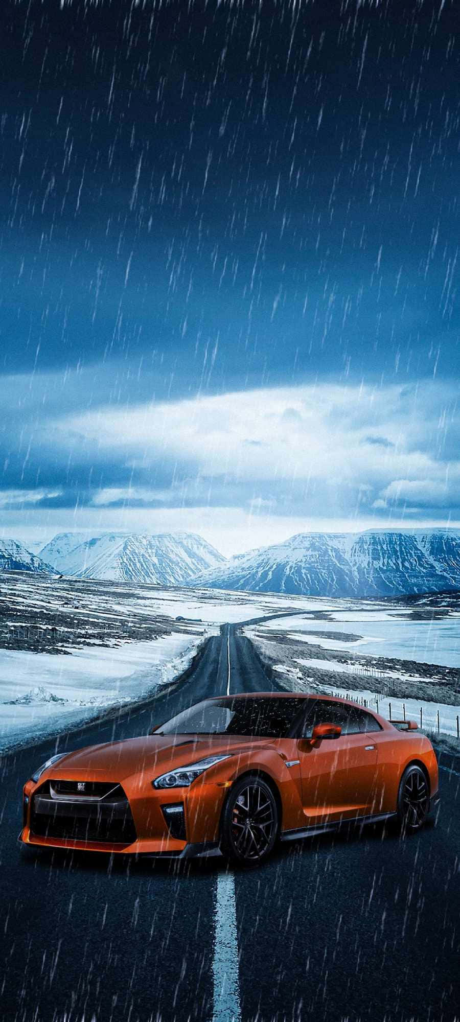a sports car driving down a road in the rain Picha ya Ukuta
