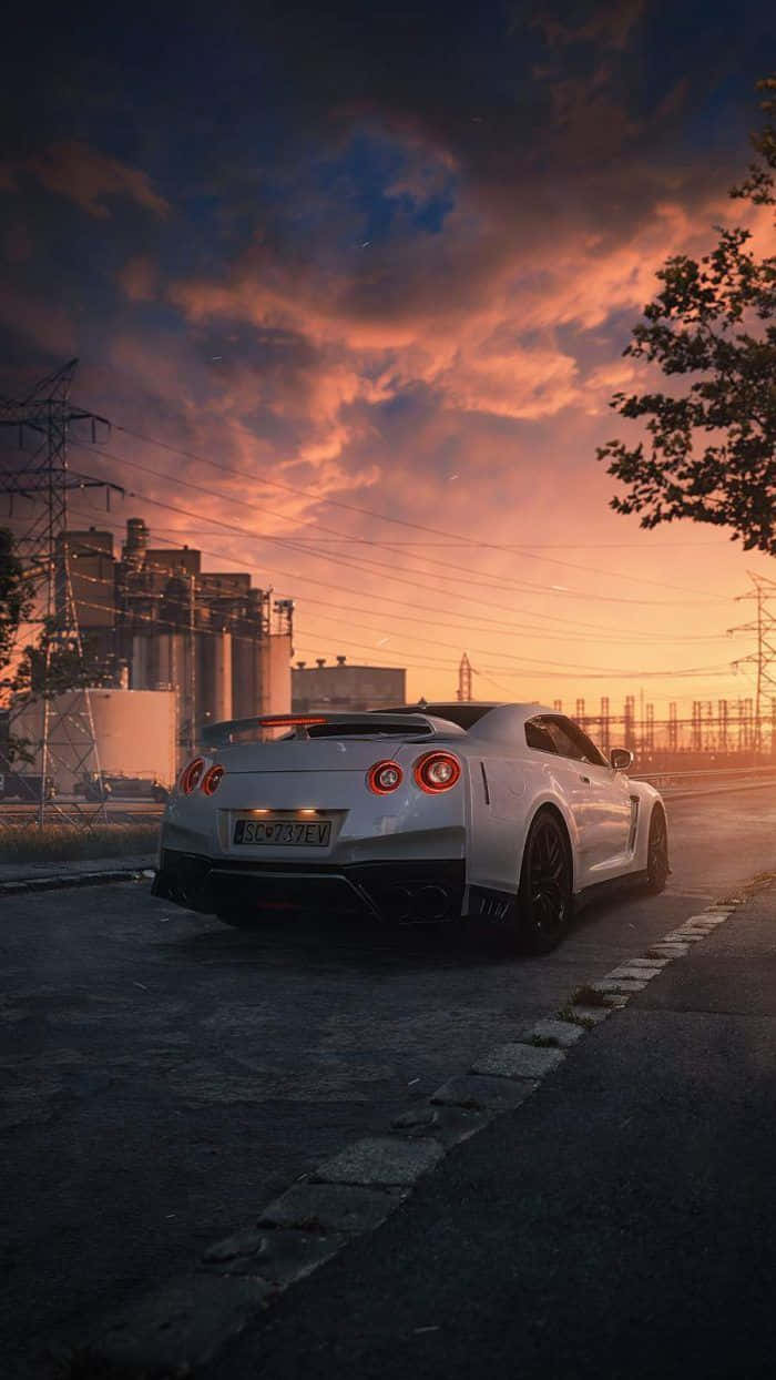Mandhari ya Machweo ya Nissan Skyline kwa iPhone Picha ya Ukuta