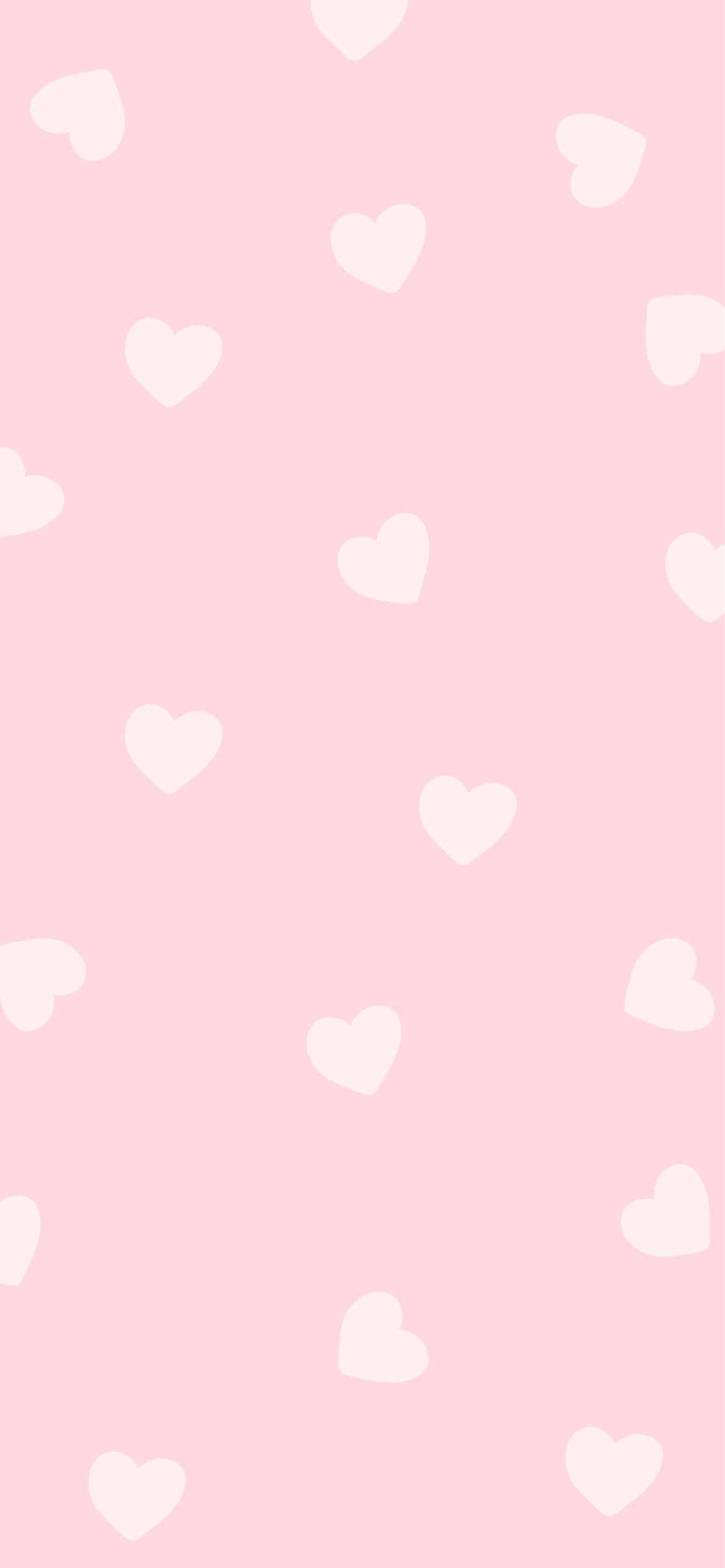mandharinyuma ya pinki yenye mioyo myeupe juu yake Picha ya Ukuta