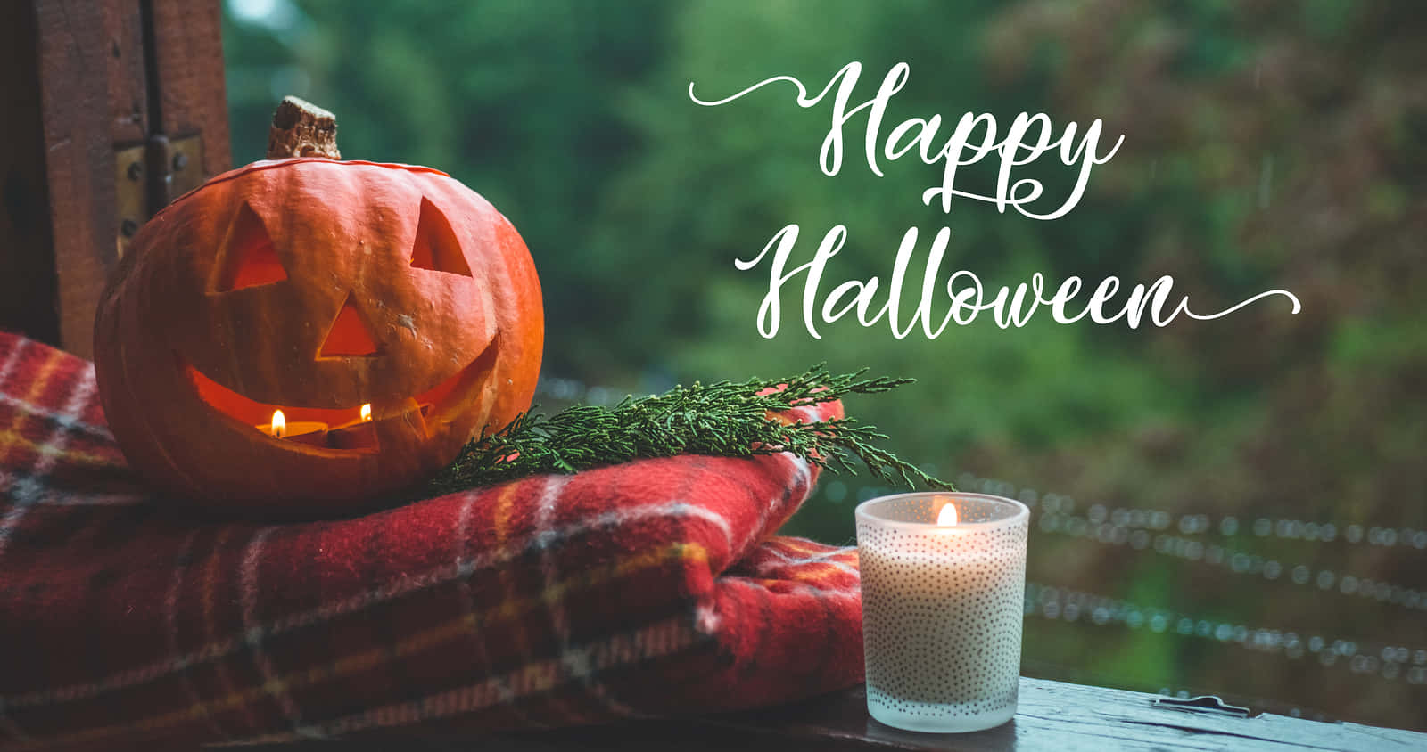 Mandio ya Maboga ya Halloween Juu ya Blanketi Nyekundu Picha ya Ukuta