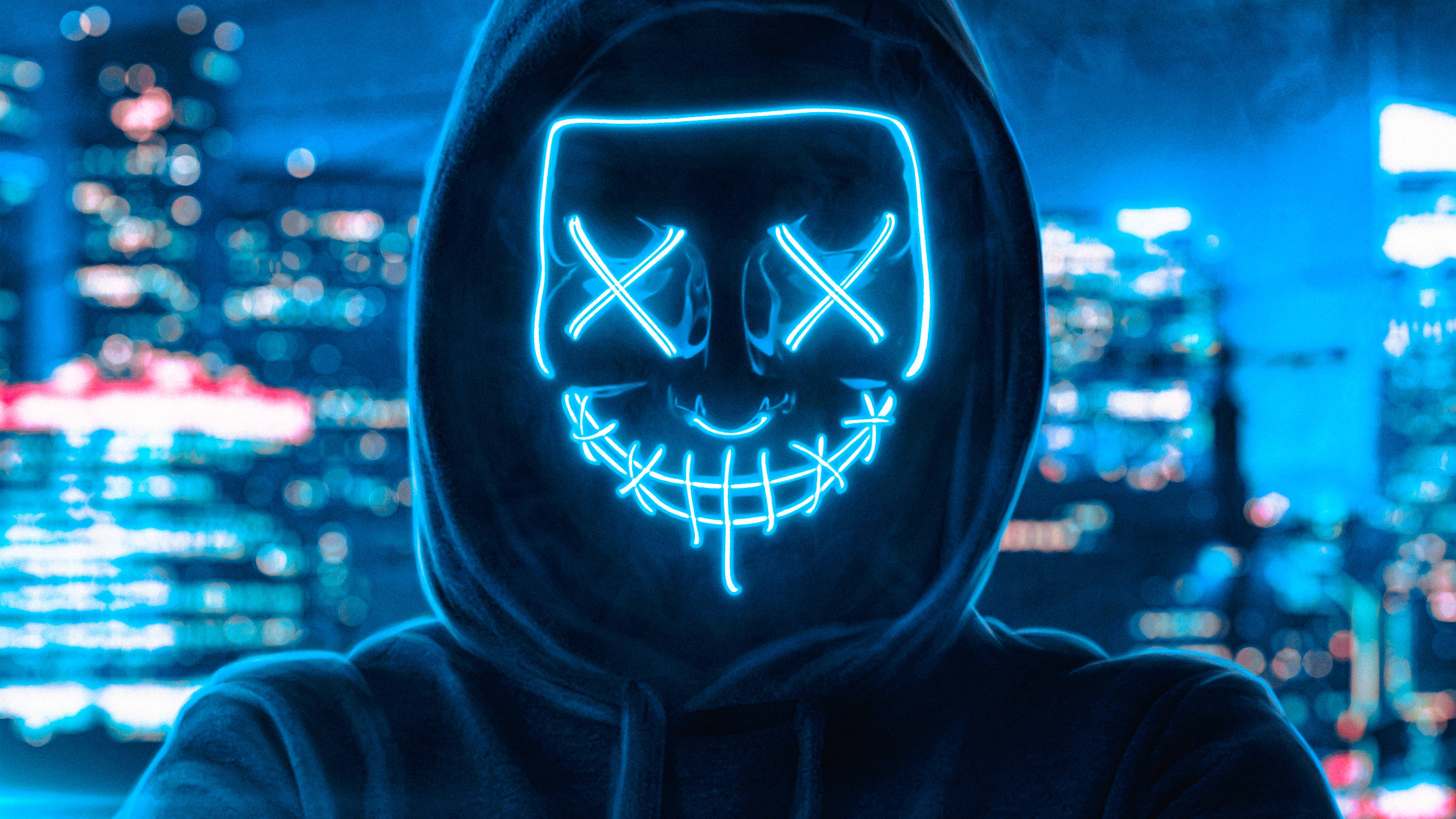 Mtu Akiwa na Kifaa cha Kuficha Uso cha Mwanga wa Bluu wa Neon Picha ya Ukuta