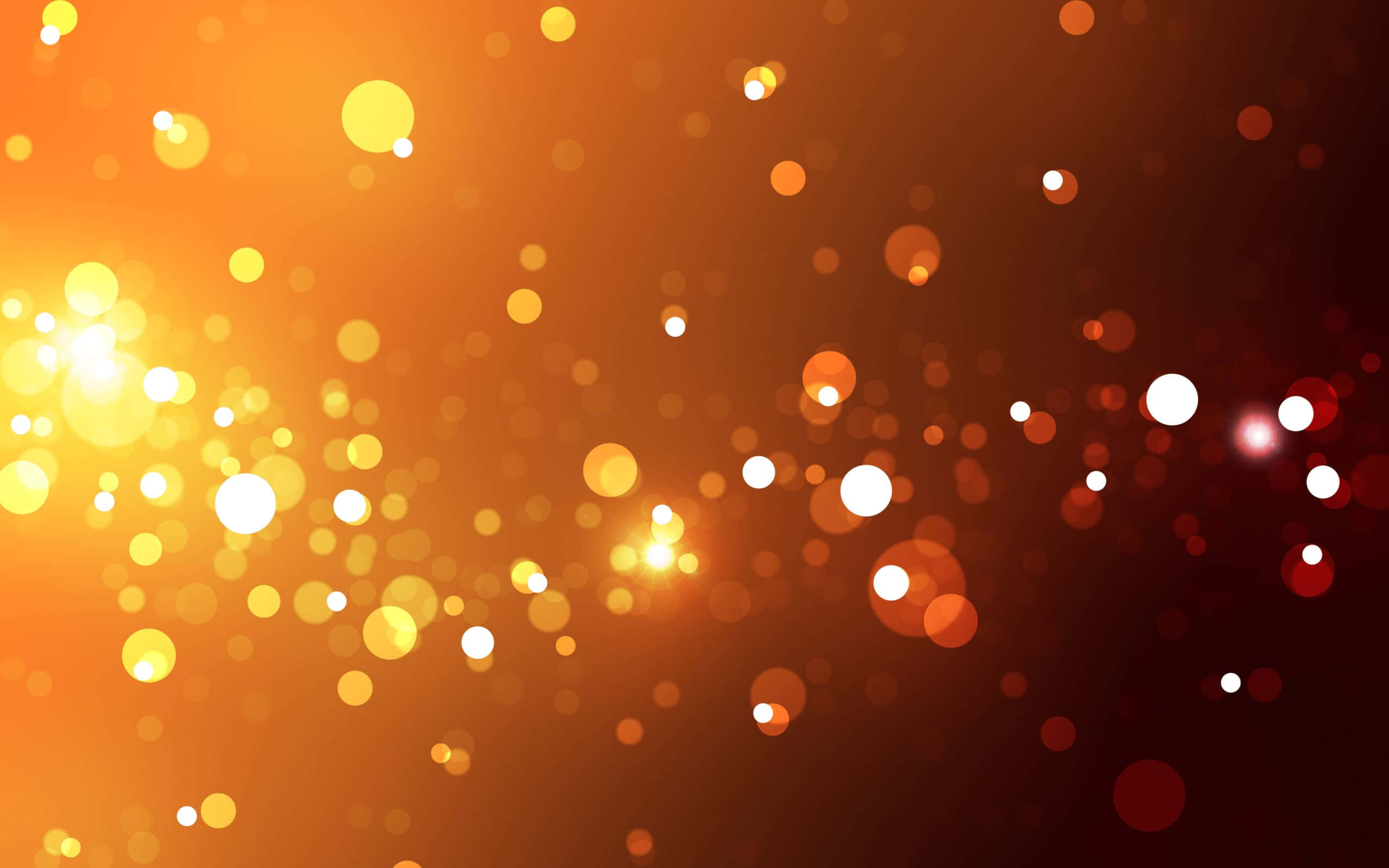 Mwitikio wa Bokeh kwenye Mandhari ya Rangi ya Nyeusi na Orange Picha ya Ukuta
