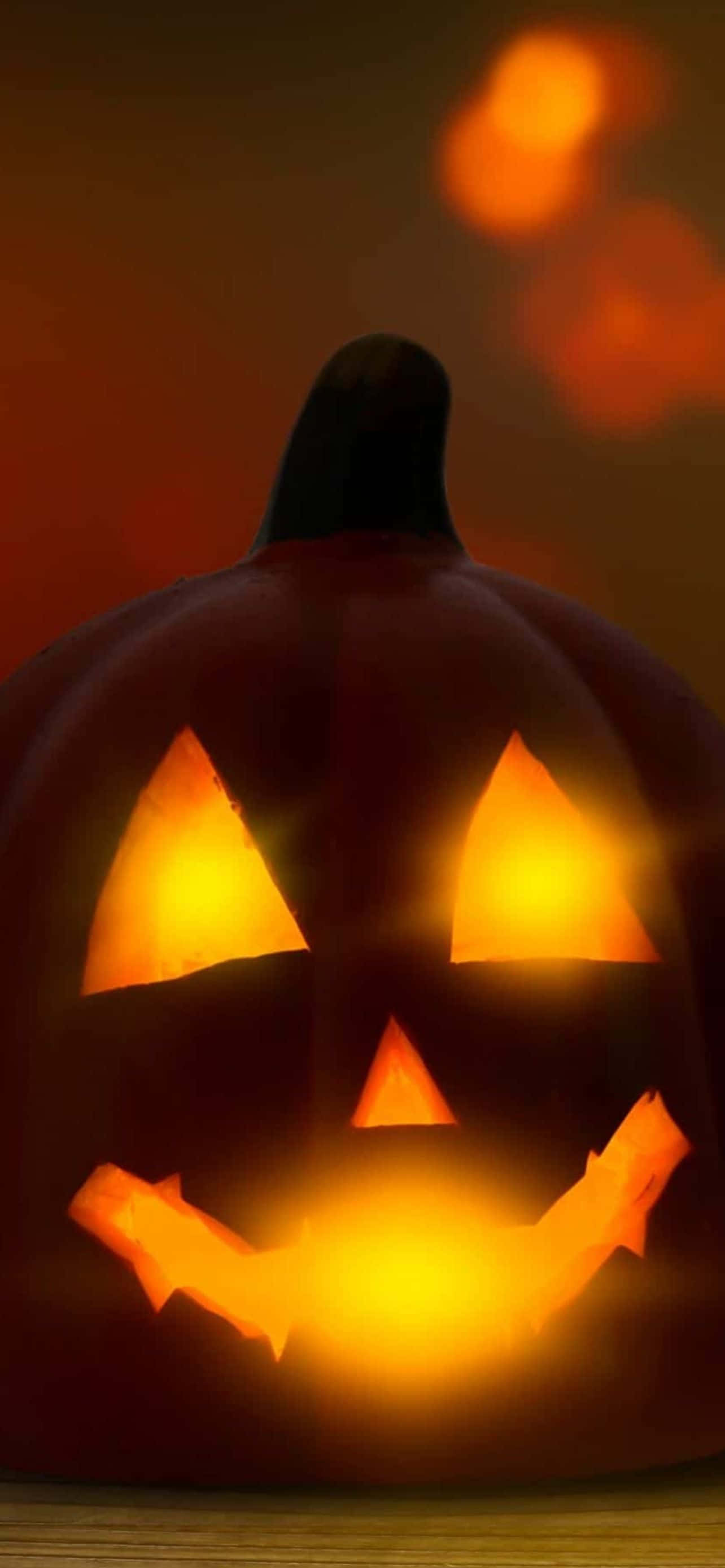 Ongeza Burudani ya Kutisha kwenye Simu Yako kwa Picha ya Mandhari ya Halloween ya iPhone Picha ya Ukuta