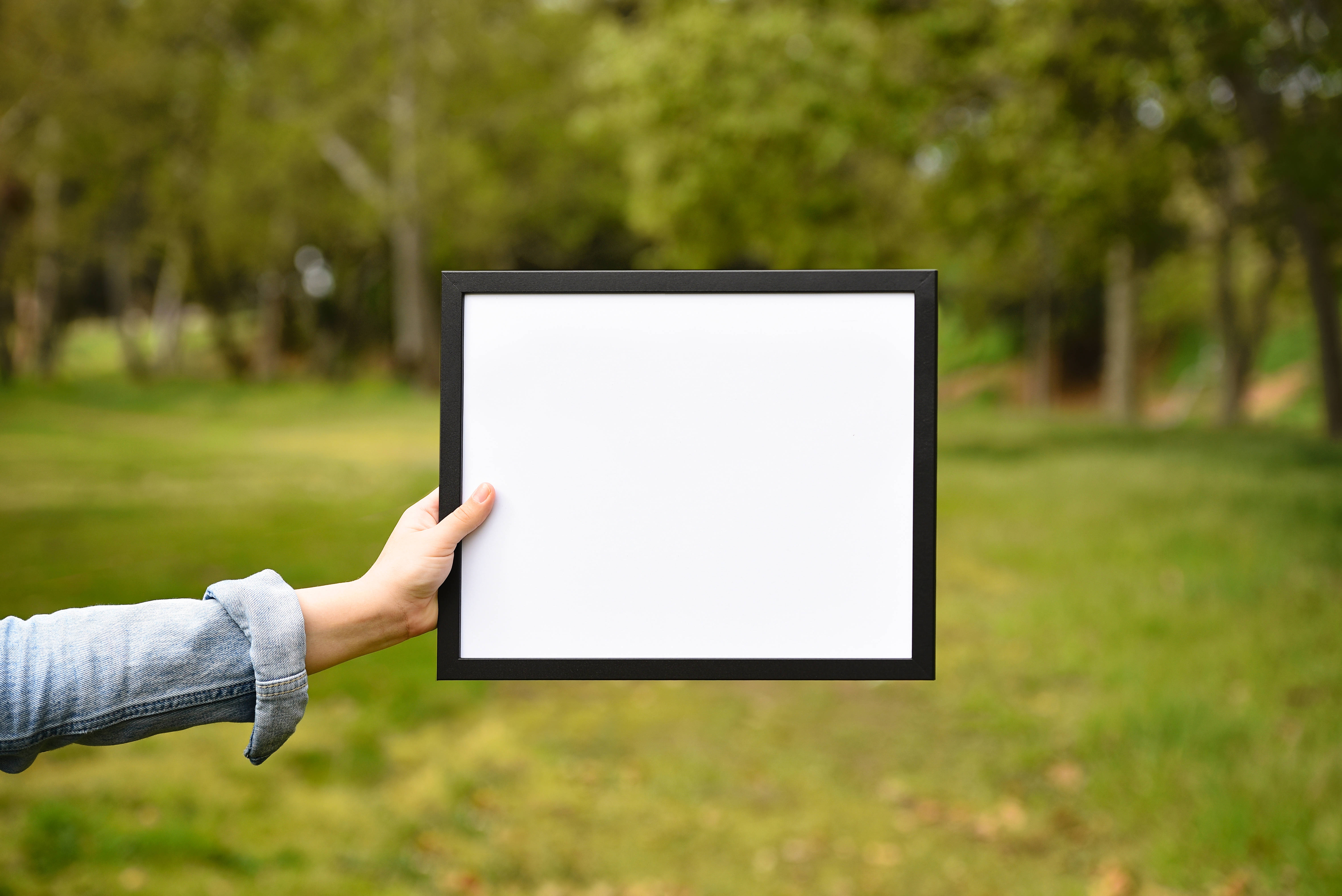 Person Holding White And Black Panel Picha ya Ukuta