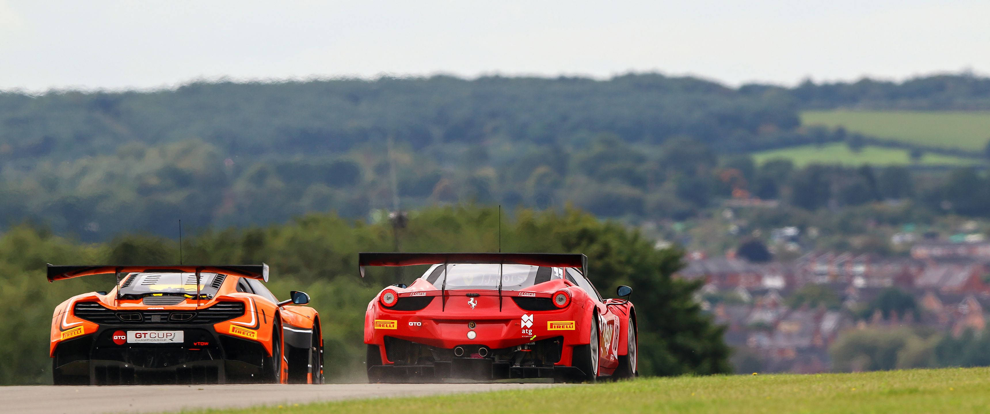 Racers Prepare to Battle on a Track Picha ya Ukuta
