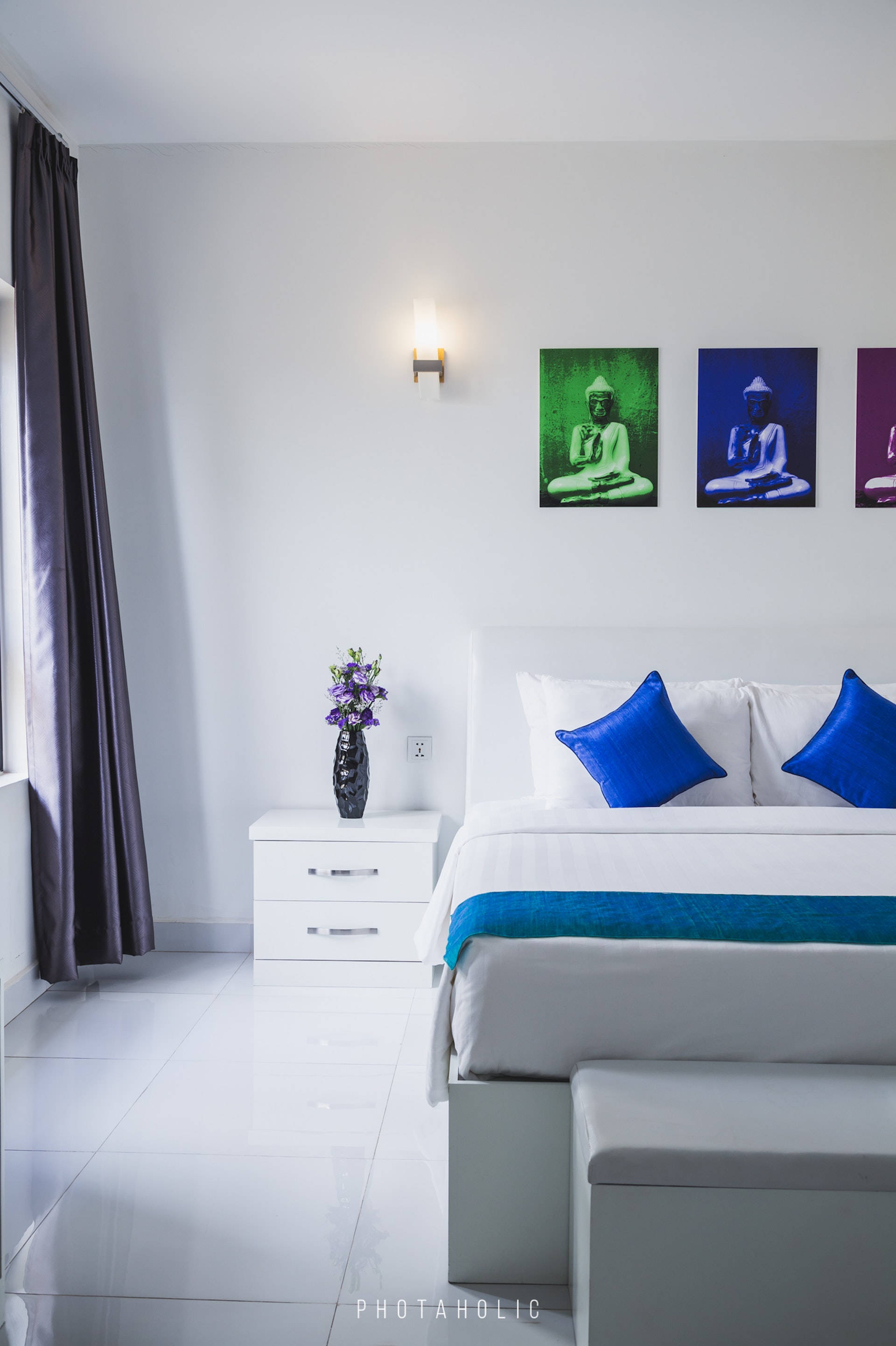 Serene White Bedroom with Blue Accent Pillows Picha ya Ukuta