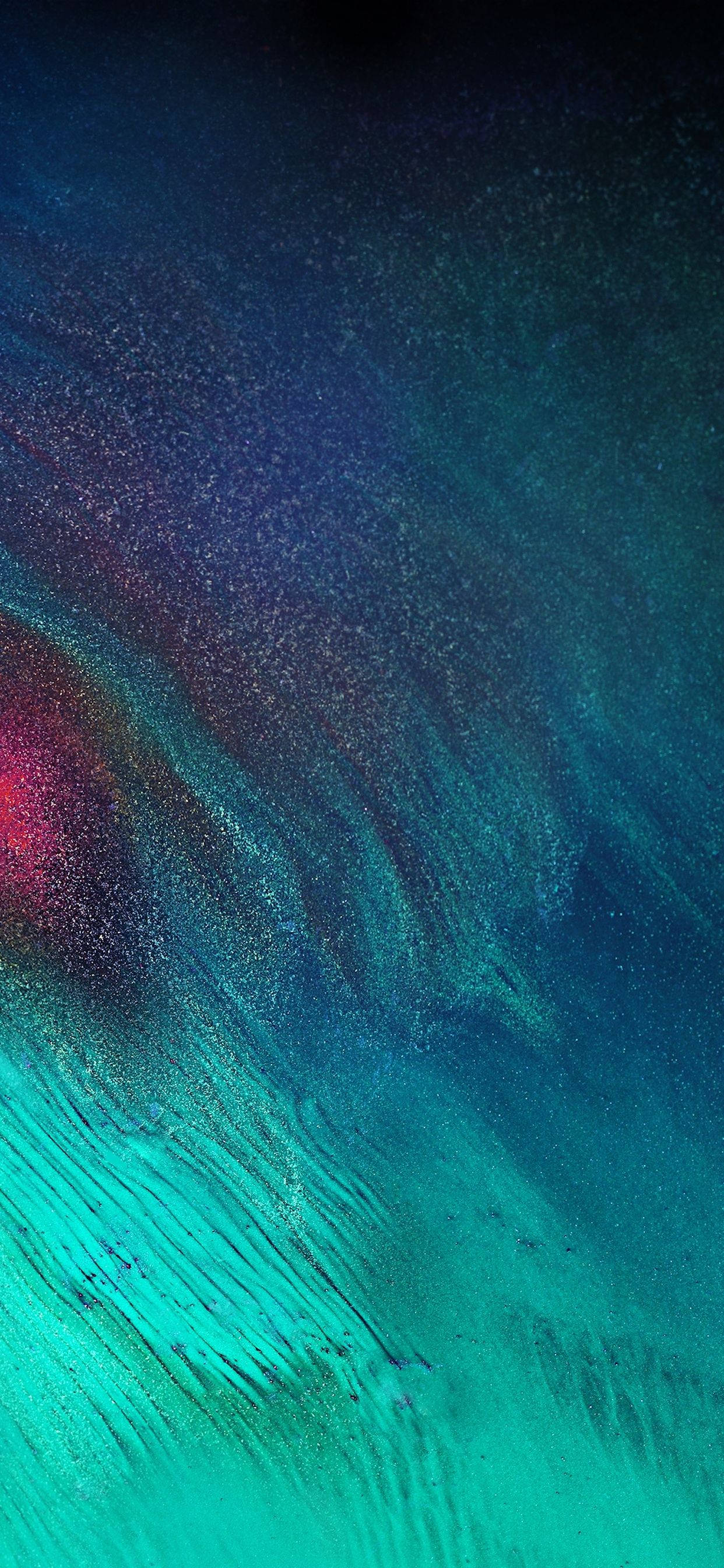 Simu ya iPhone yenye Mng'aro wa Rangi za Kufikirika Picha ya Ukuta