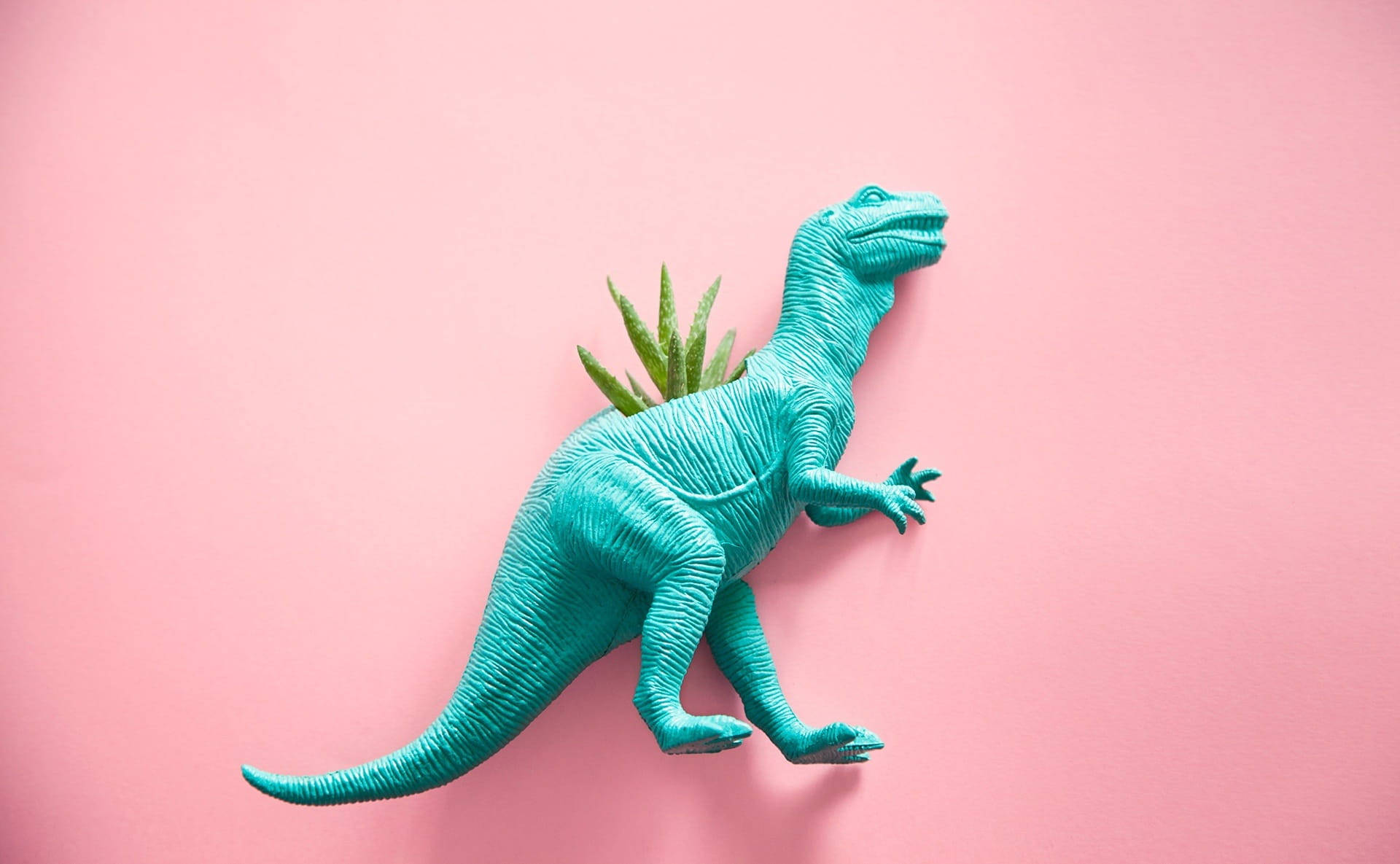 T-rex ya Kijani Kibichi Mzuri Akiwa na Mmea Picha ya Ukuta