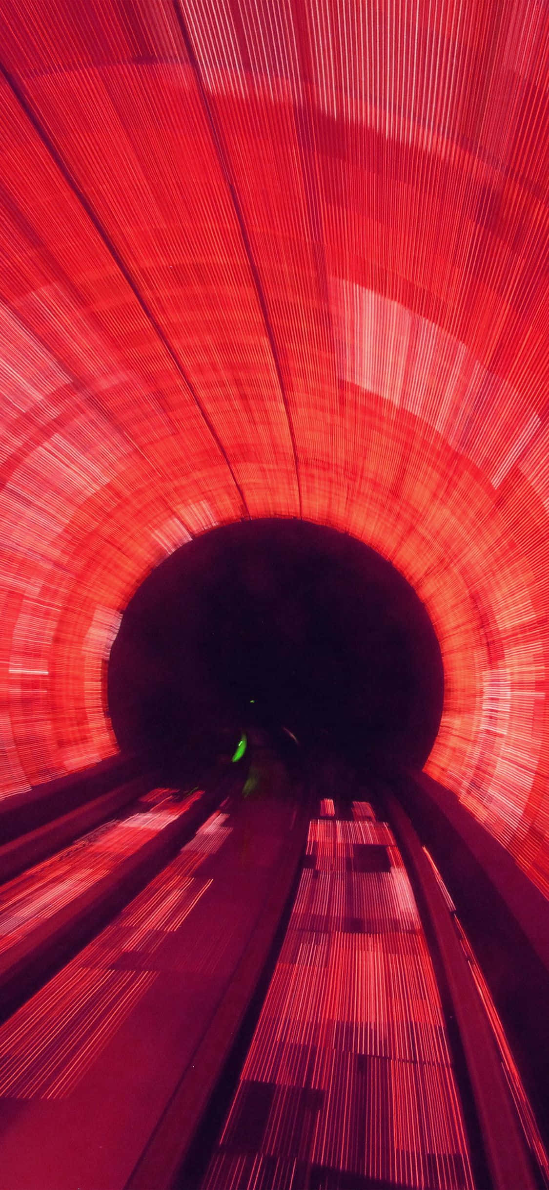 Tunnel In Light Red Background Picha ya Ukuta