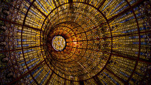 Pattern of yellow sun and women faces in cathedral window wallpaper.
